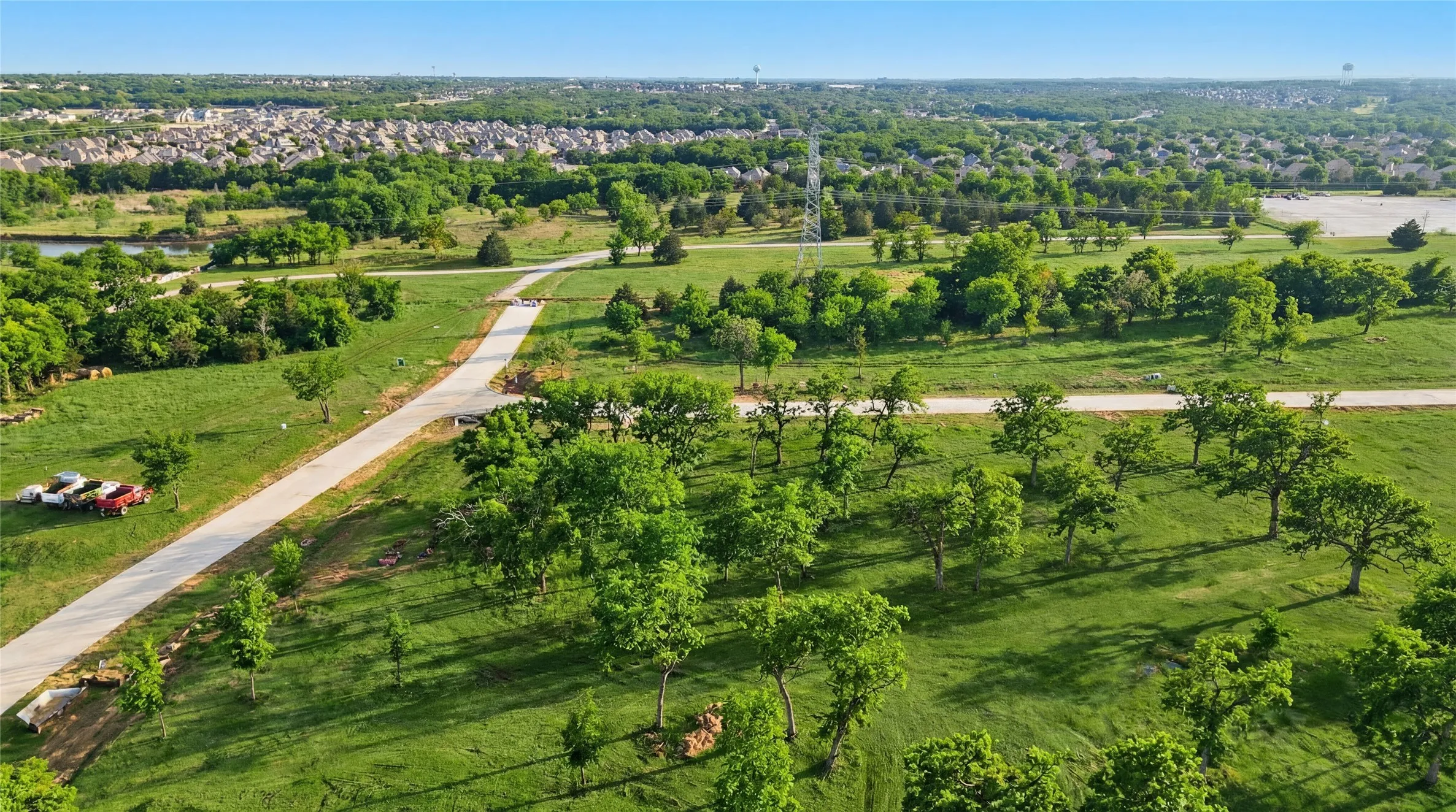 This is an aerial photograph of Lot 6 Block J and was captured in February. It has been digitally enhanced to emphasize the presence of leaves and grass.