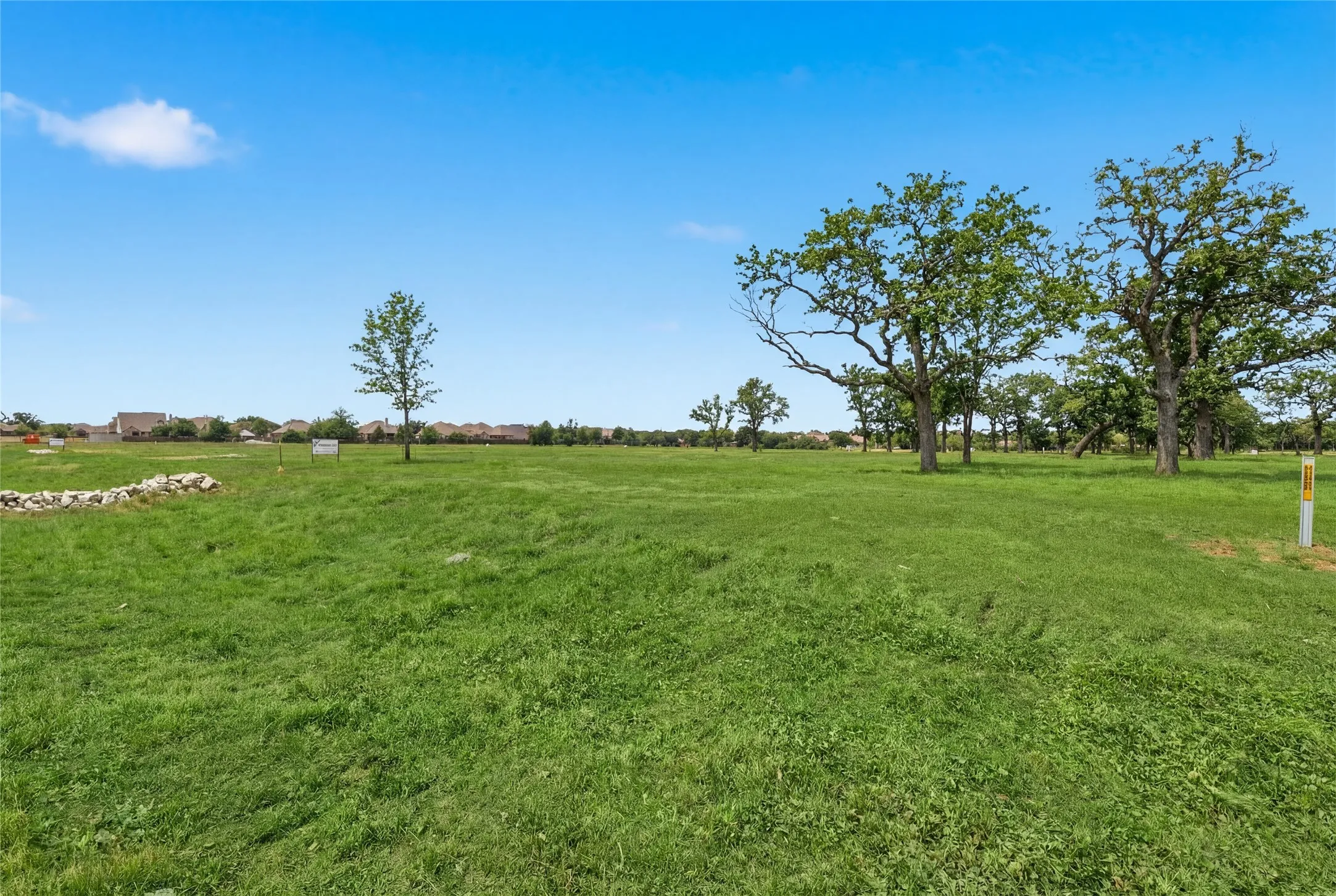 This is a photograph of Lot 8 Block J and was captured in February. It has been digitally enhanced to emphasize the presence of leaves and grass.