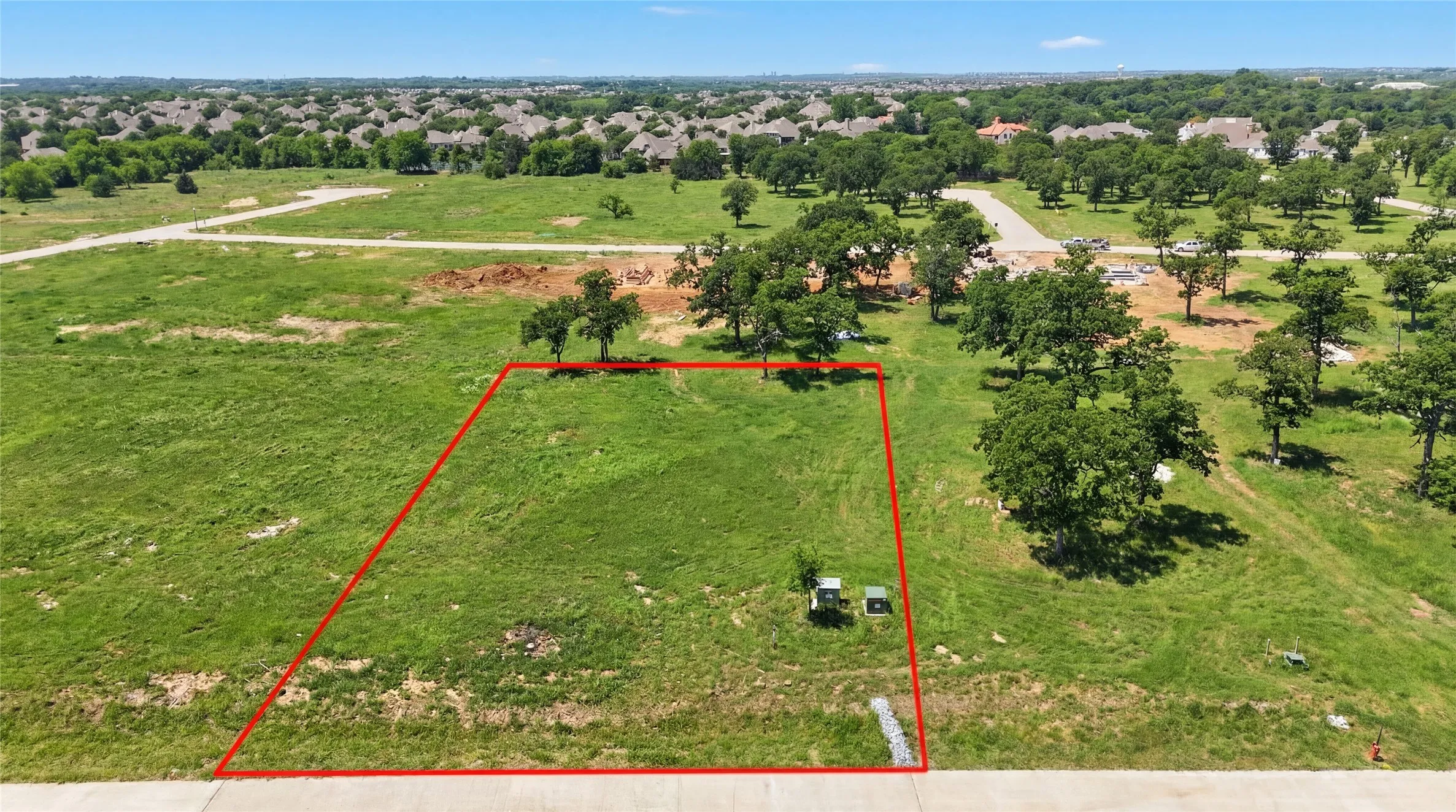 This is an aerial photograph of Lot 8 Block J and was captured in February. It has been digitally enhanced to emphasize the presence of leaves and grass.
