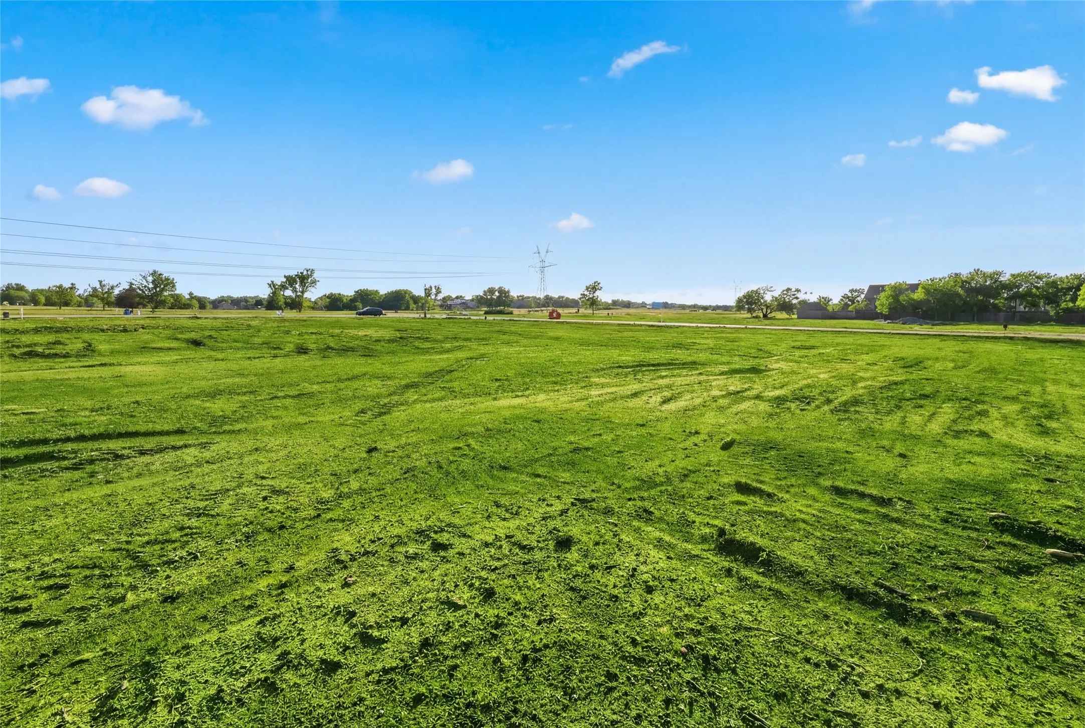 This is a photograph of Lot 10 Block J and was captured in February. It has been digitally enhanced to emphasize the presence of leaves and grass.