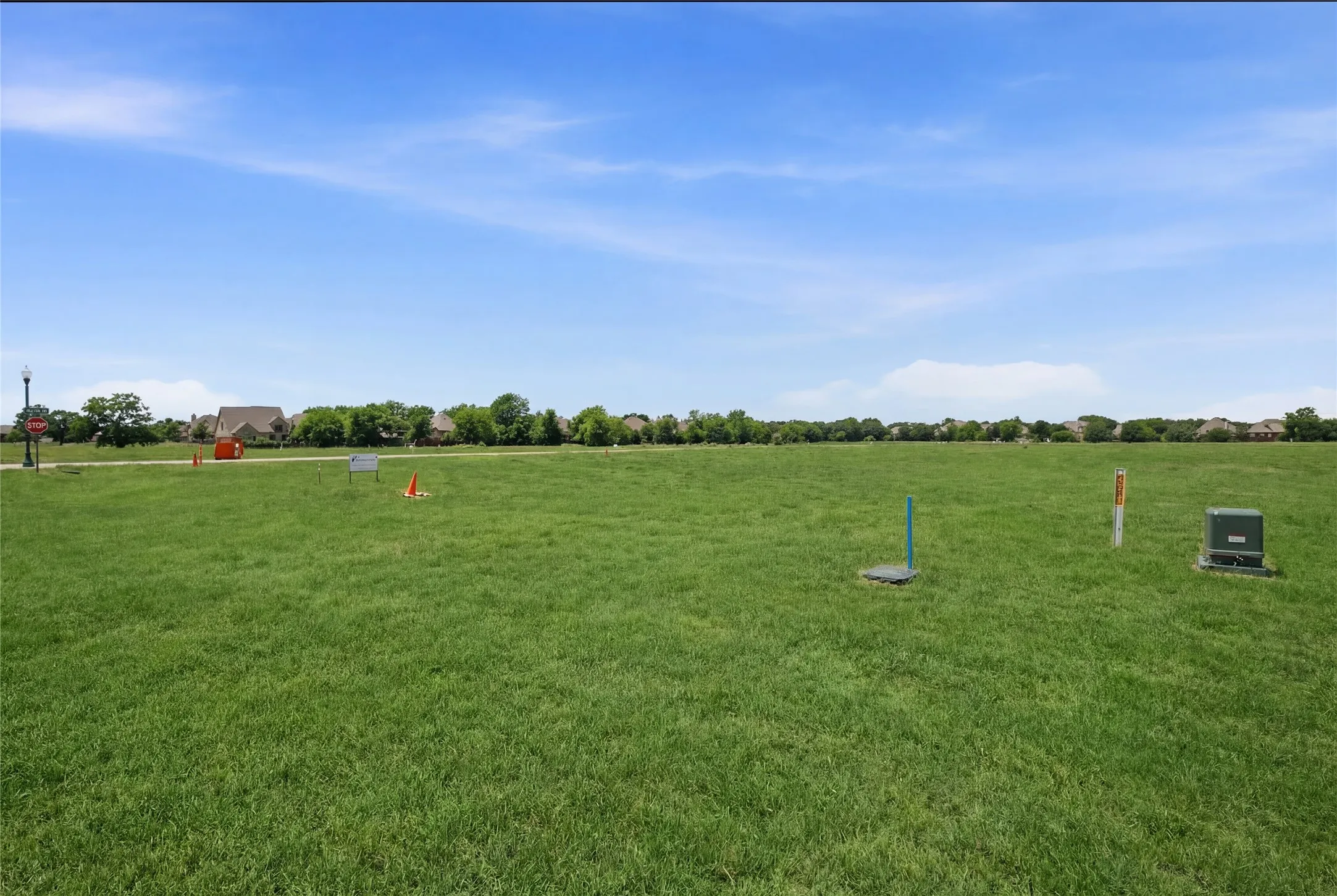 This is a photograph of Lot 10 Block J and was captured in February. It has been digitally enhanced to emphasize the presence of leaves and grass.