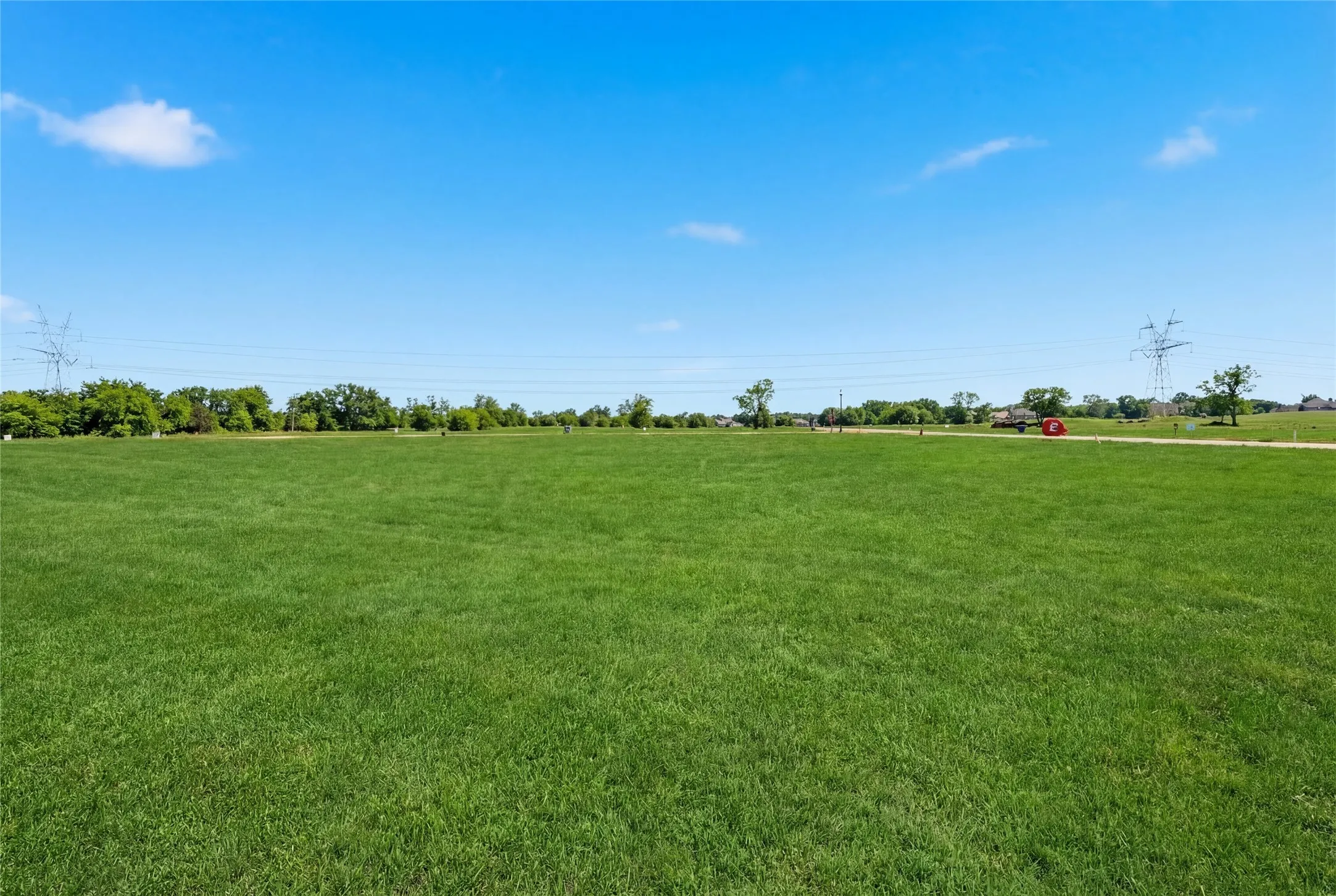 This is a photograph of Lot 10 Block J and was captured in February. It has been digitally enhanced to emphasize the presence of leaves and grass.