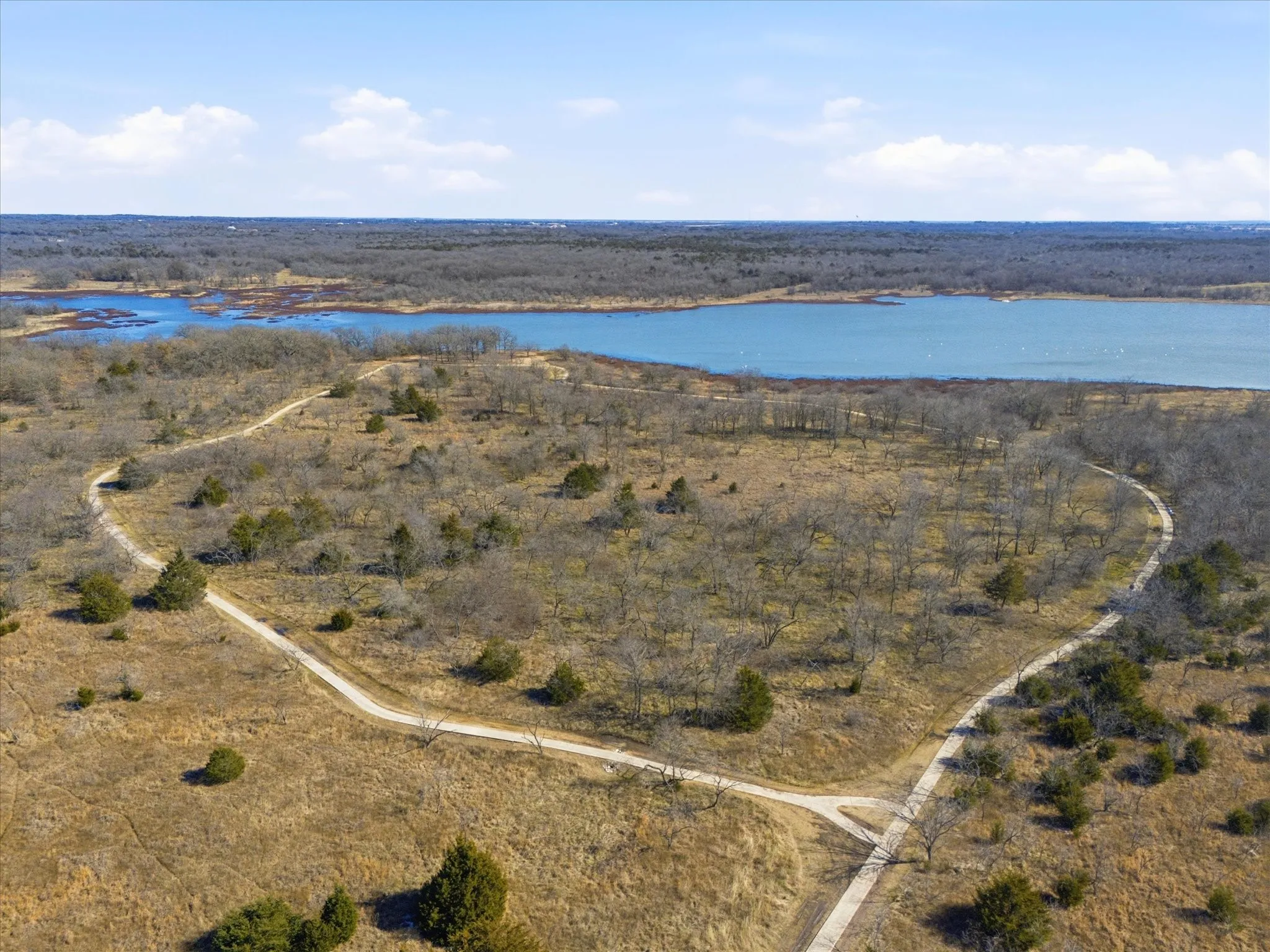 Aerial overview of property's location featuring a nearby body of water