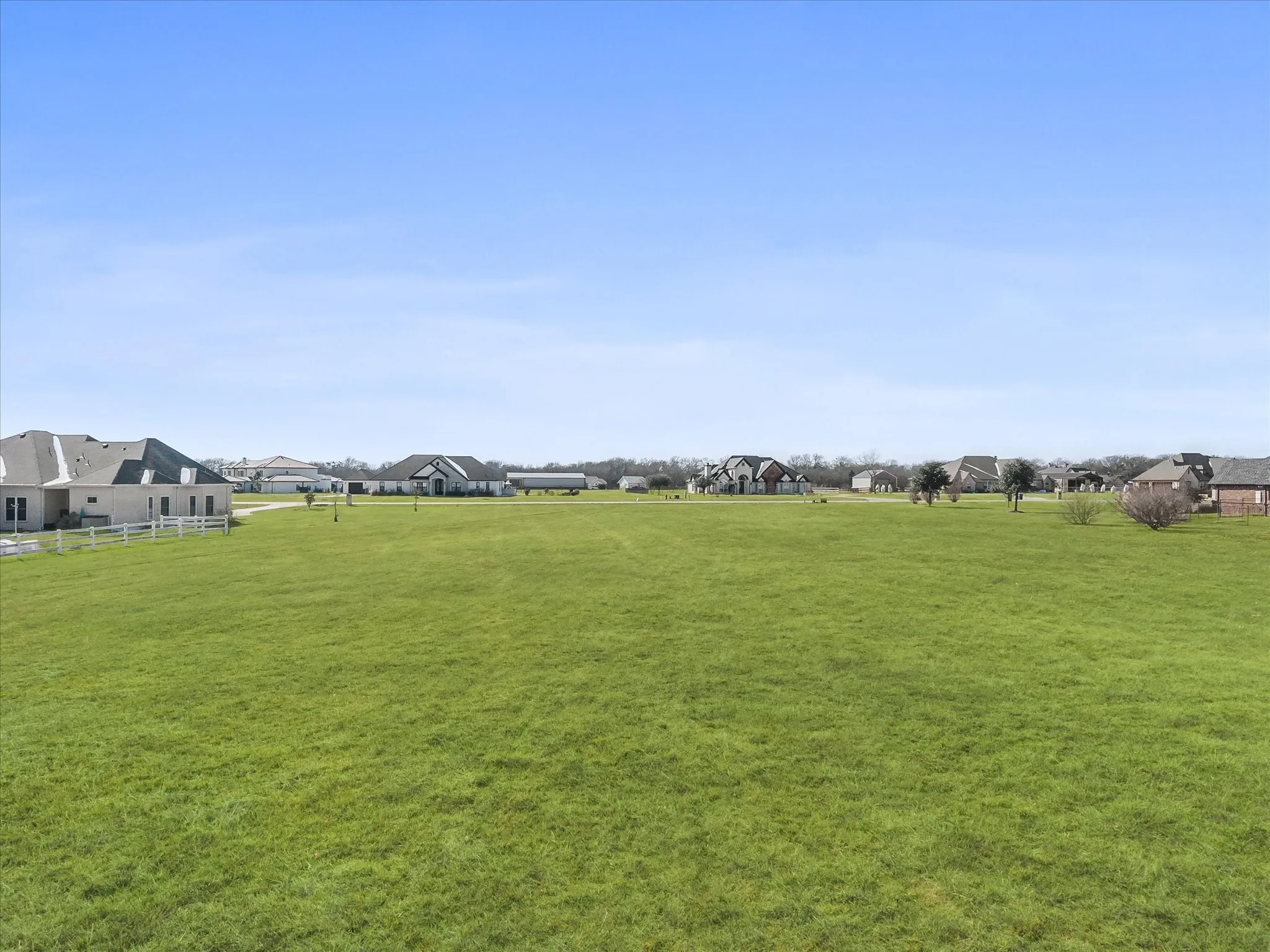 View of grassy yard with a residential view