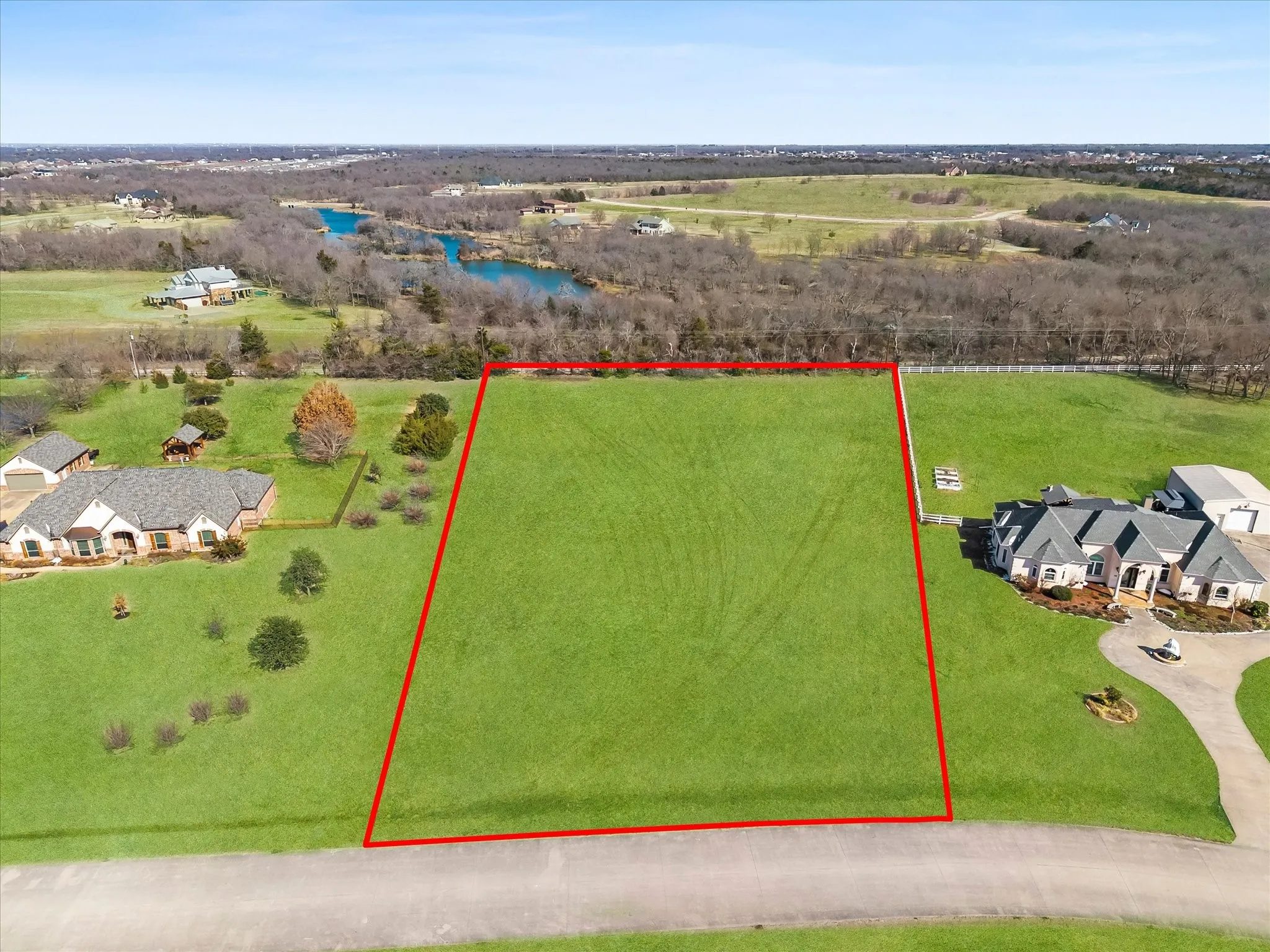 Aerial view of property and surrounding area featuring property parcel outlined