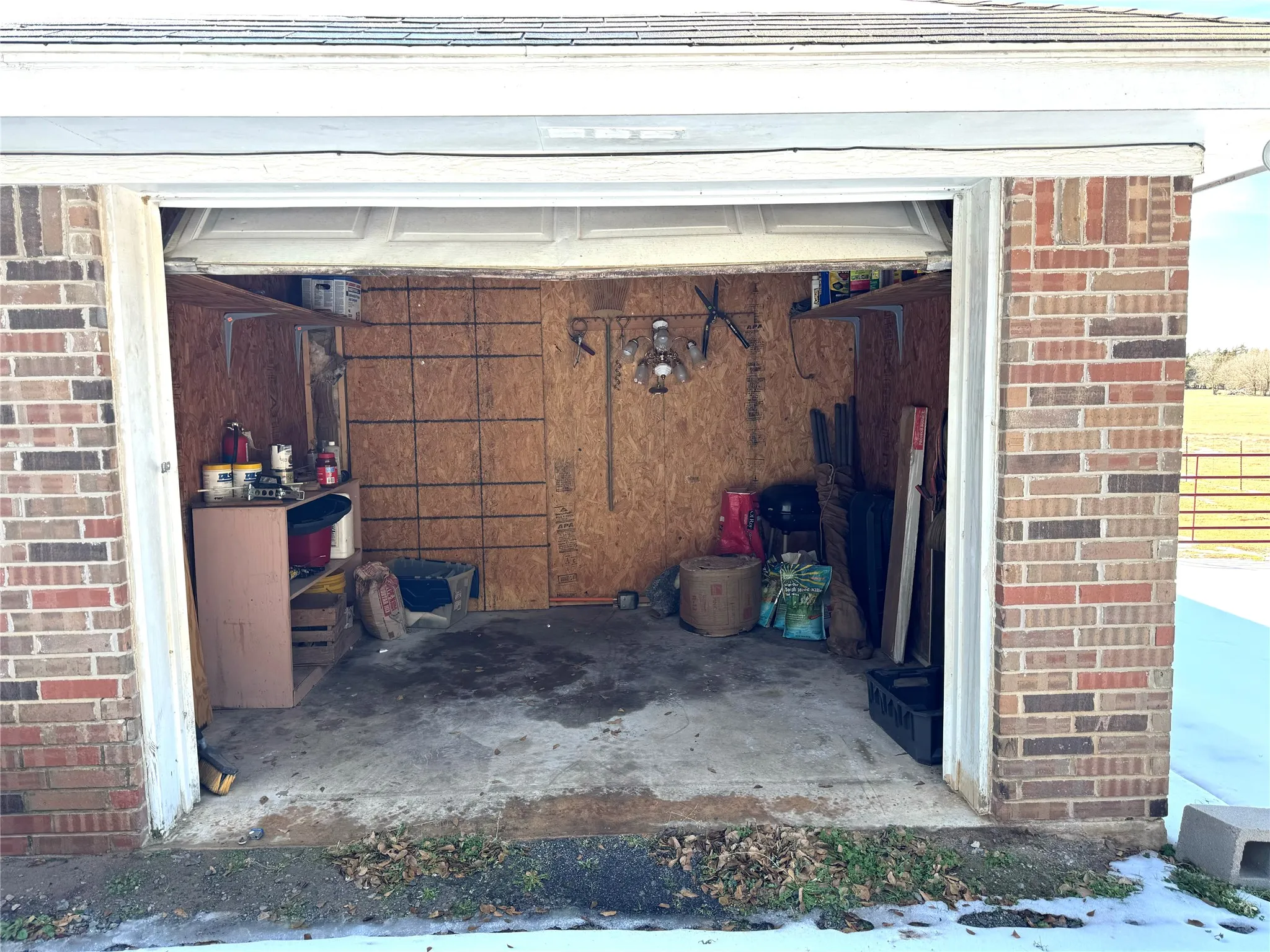 Garage at the front has storage. Behind wall was closed in to make additional room. Has no heat and air to it just a room with electrical. Access to room from inside home.