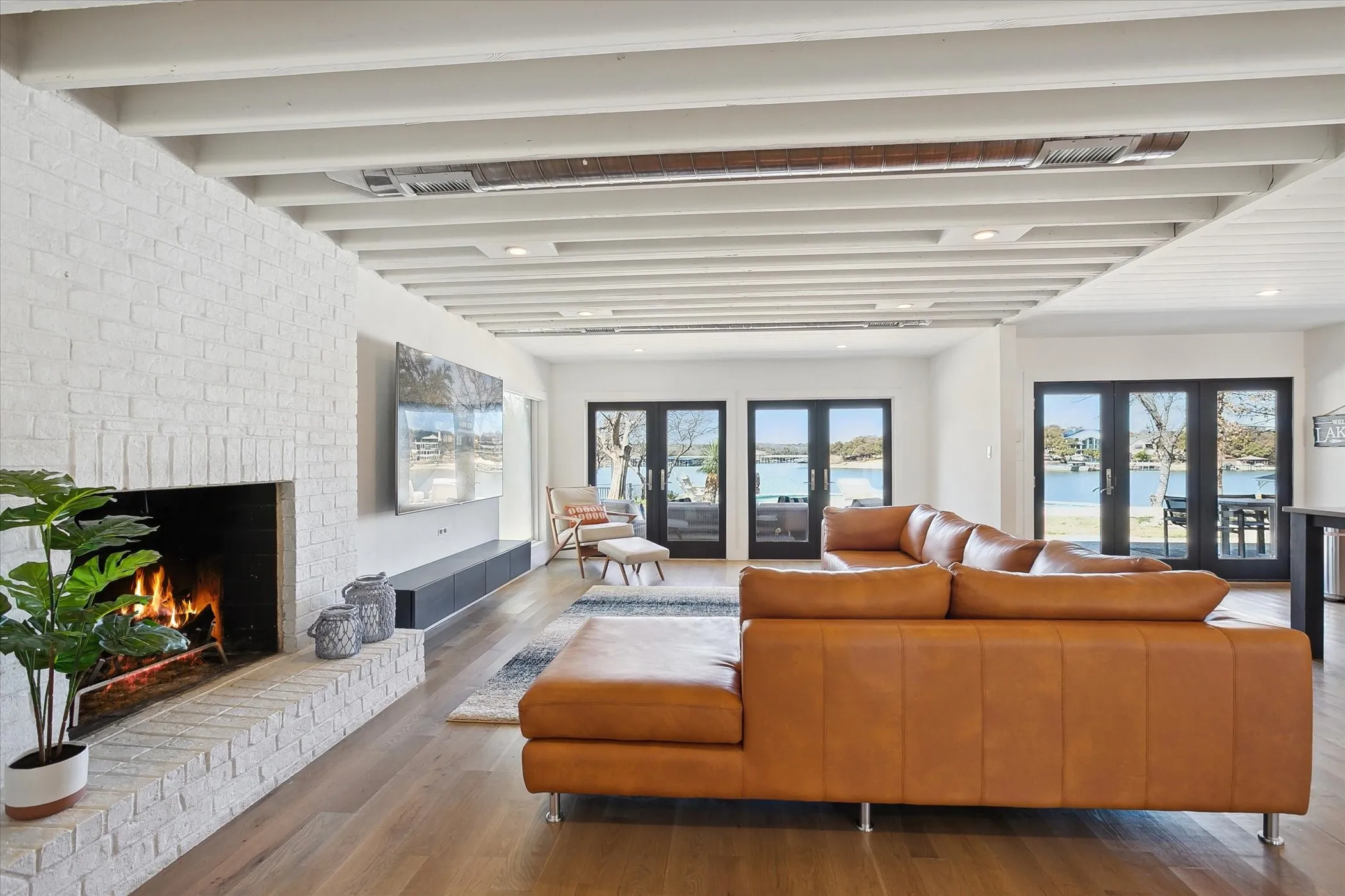 Living room with fireplace and view of the water.