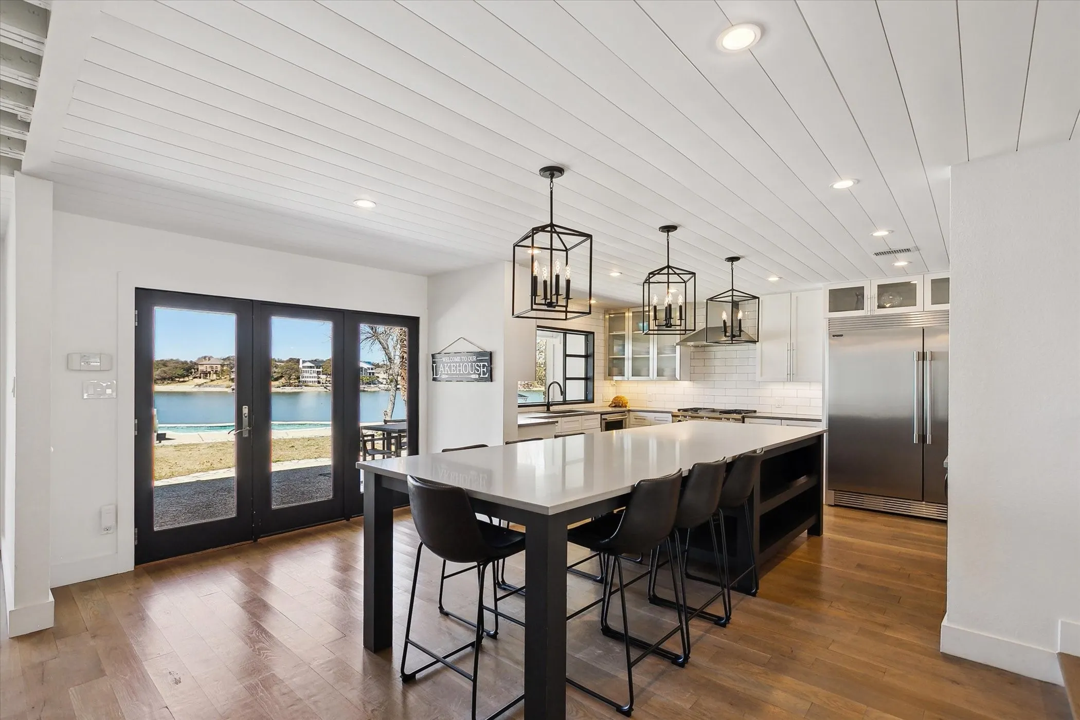 Large kitchen island, recessed lighting, french doors and water view!
