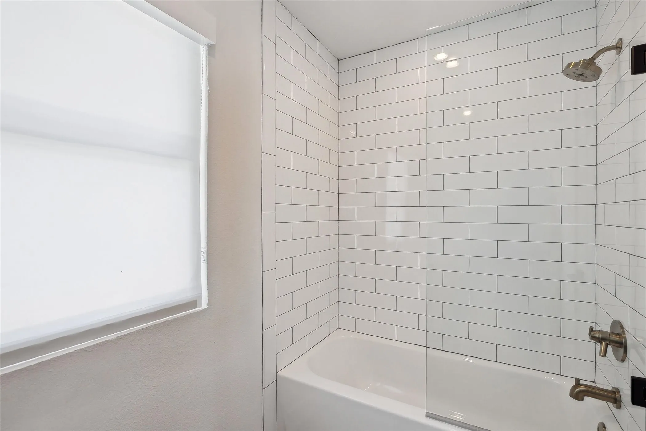Bath/shower in jack and jill bathroom.
