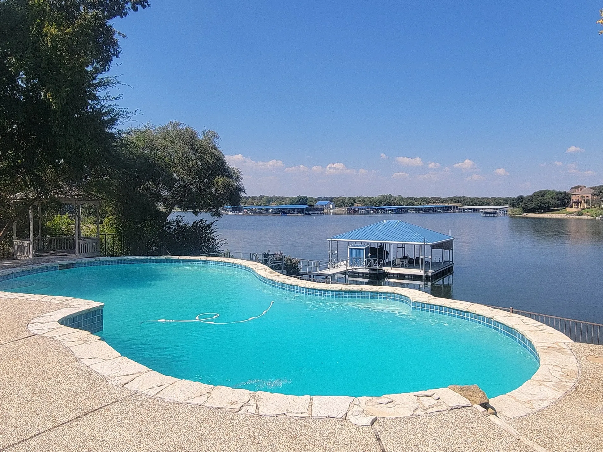 Pool with view of water.