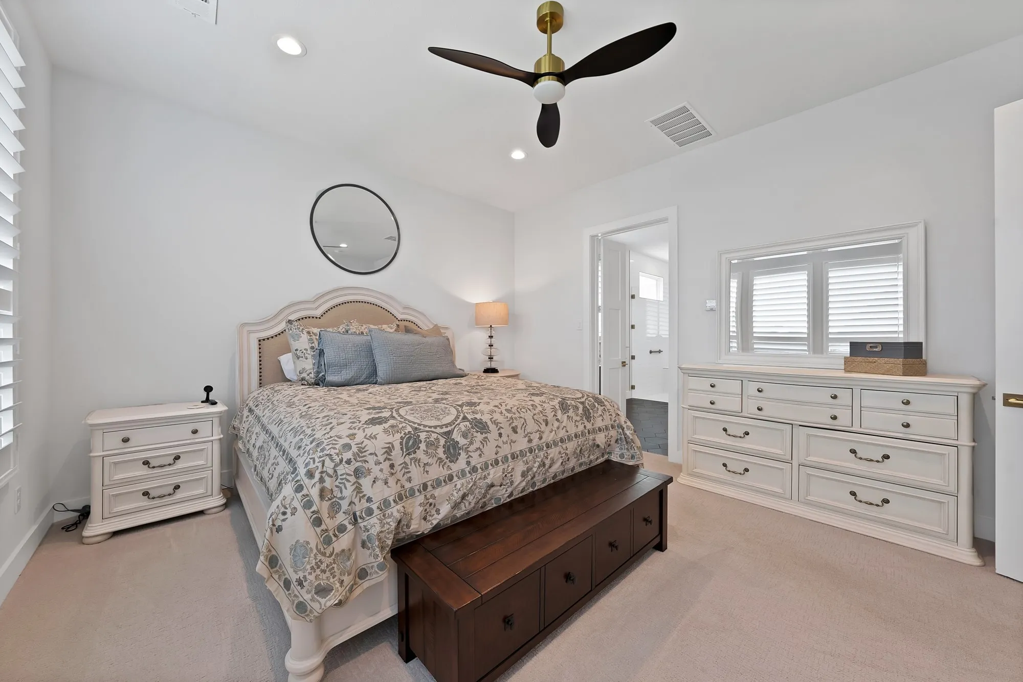 Carpeted room featuring a ceiling fan with brass accents, recessed lighting, and white walls