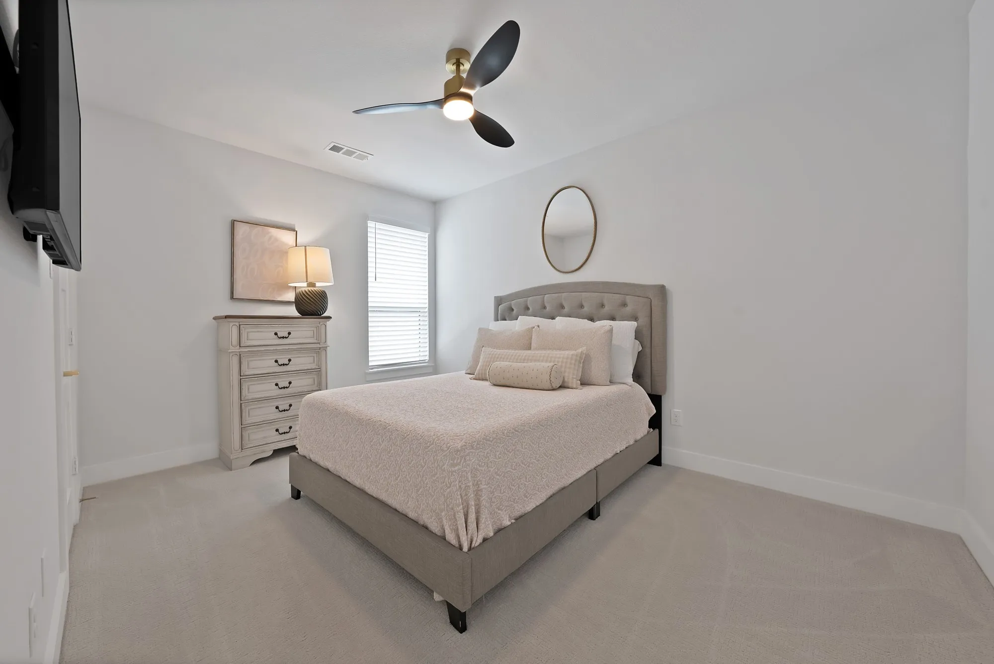 Carpeted room featuring a ceiling fan with integrated lighting, a window with horizontal blinds, and white baseboards