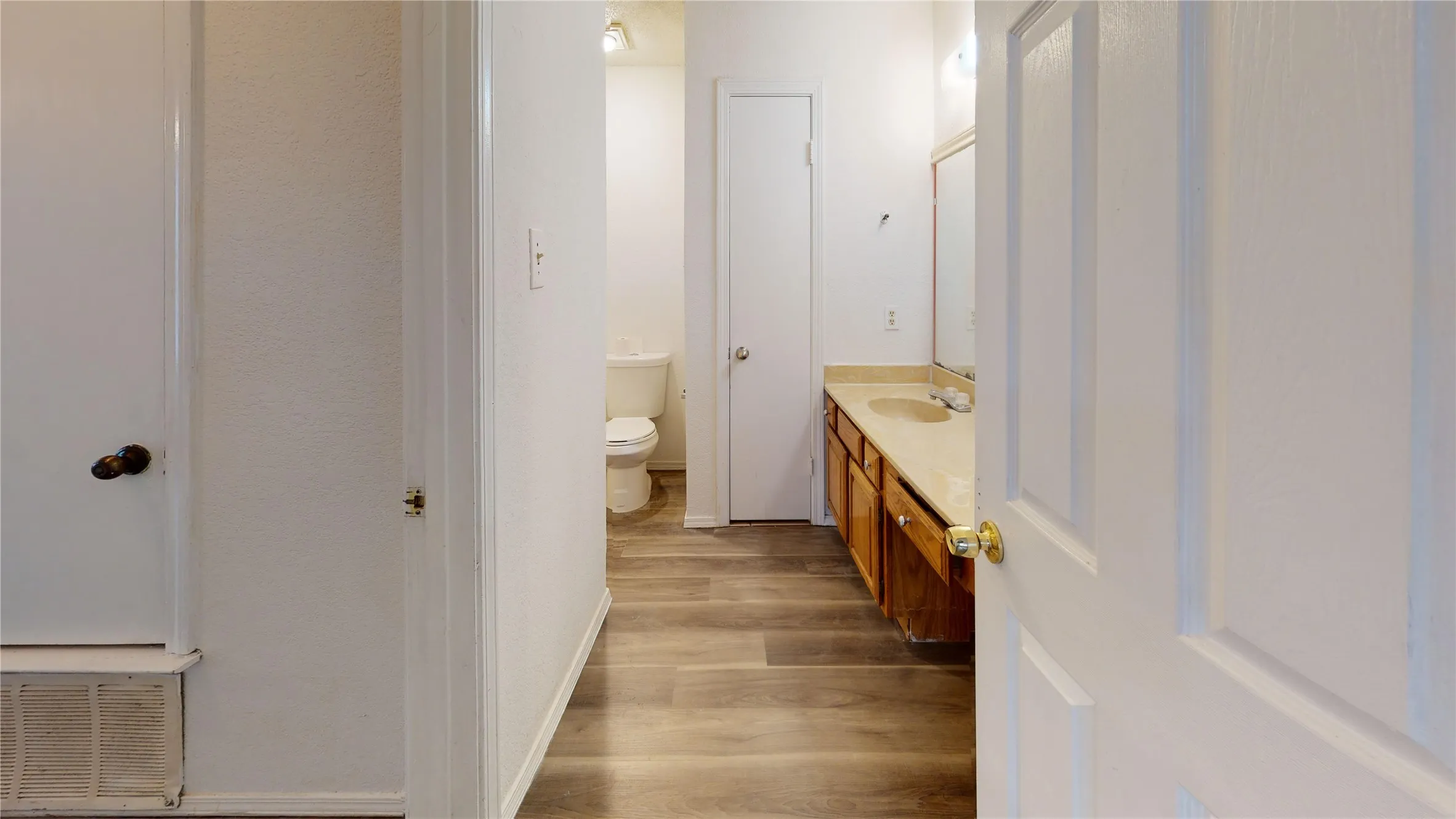 Bathroom featuring vanity and light wood-style flooring