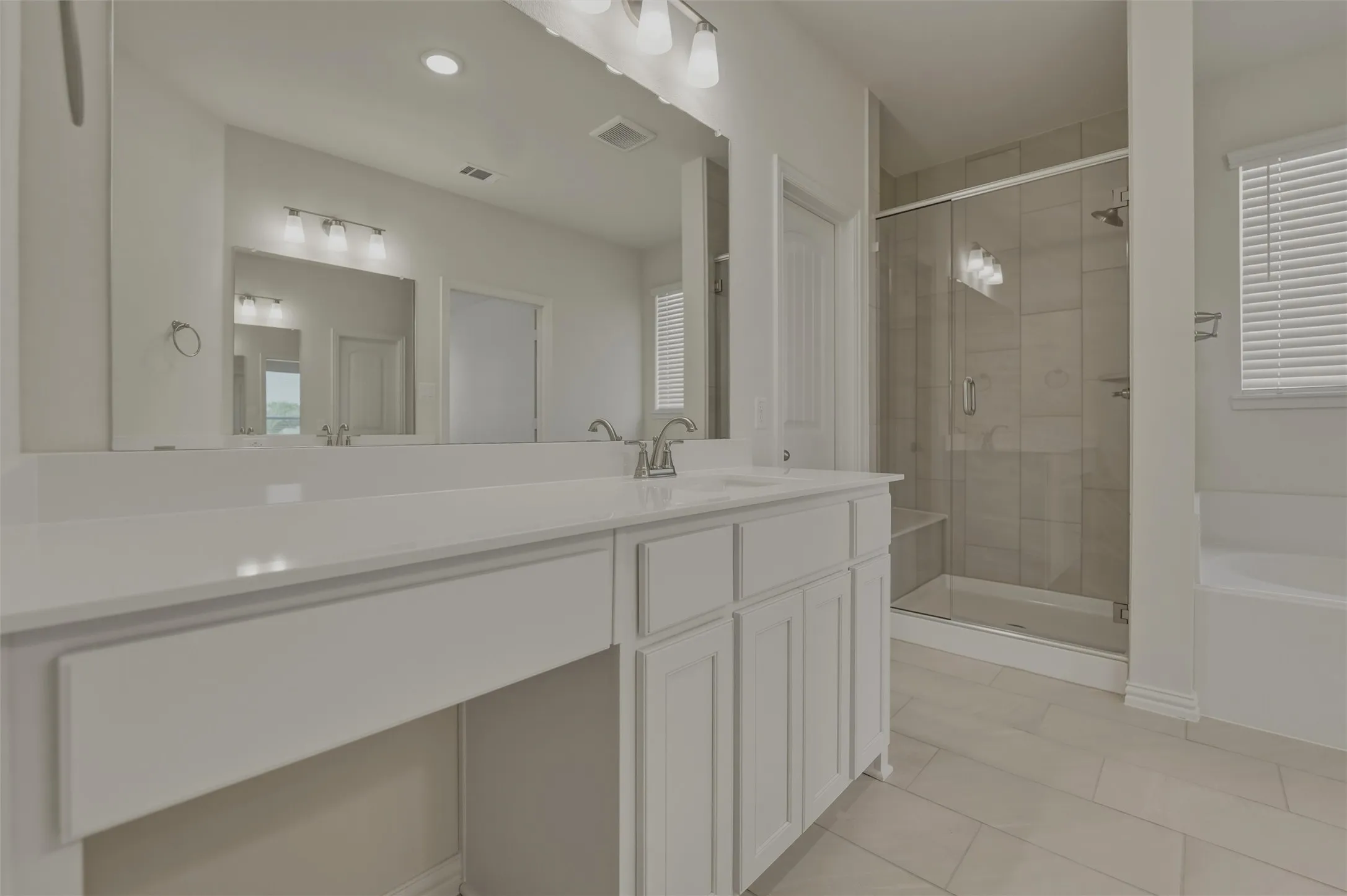 Dual vanity with white cabinetry and integrated sinks