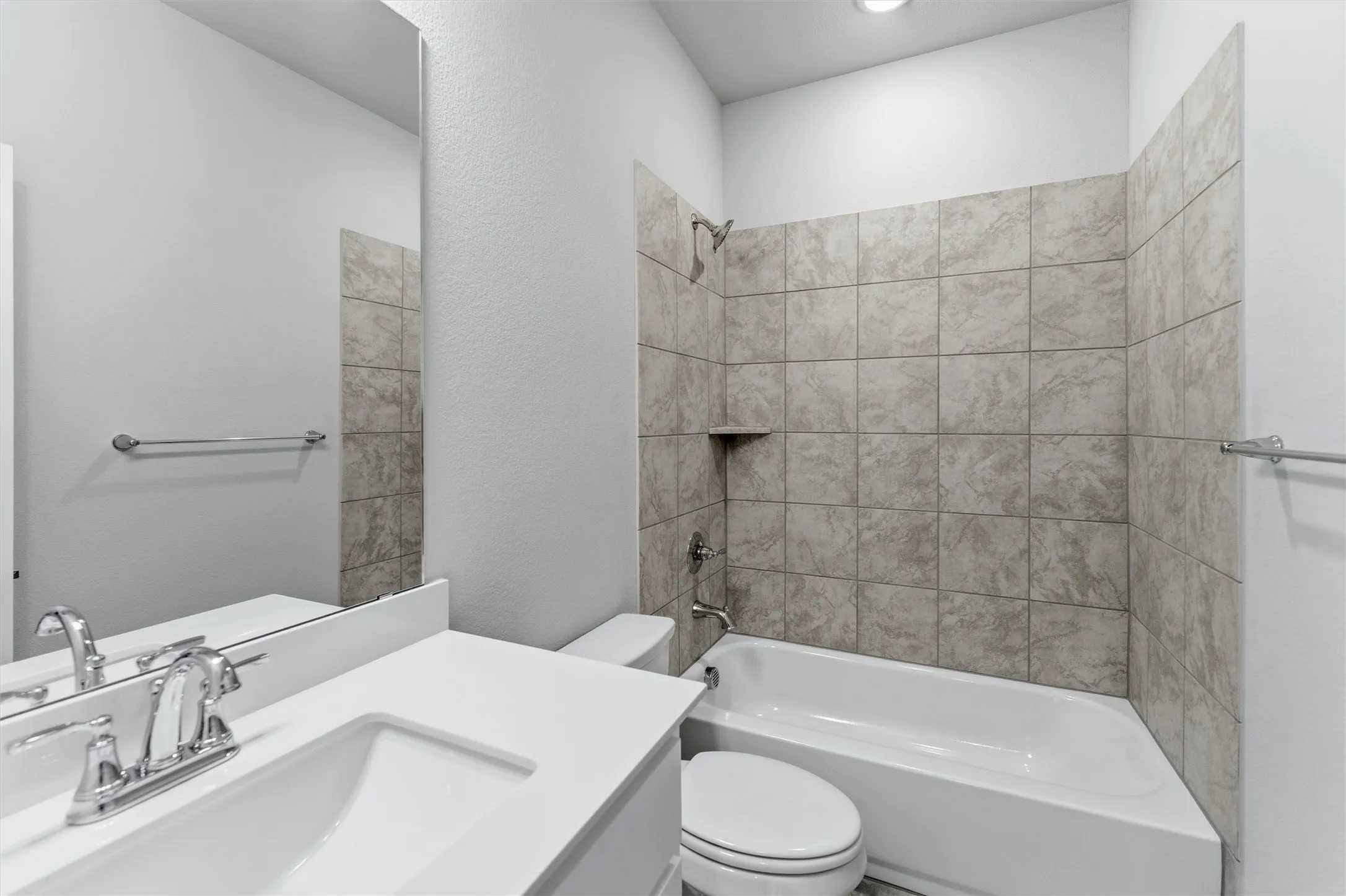Bathroom with vanity and  shower combination