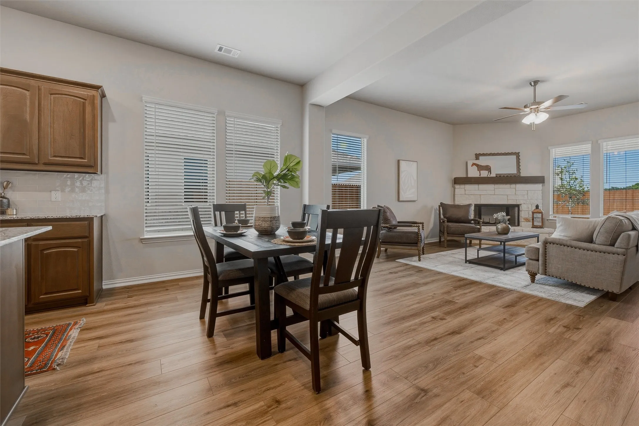 Wood-finish flooring throughout, complemented by light-colored walls