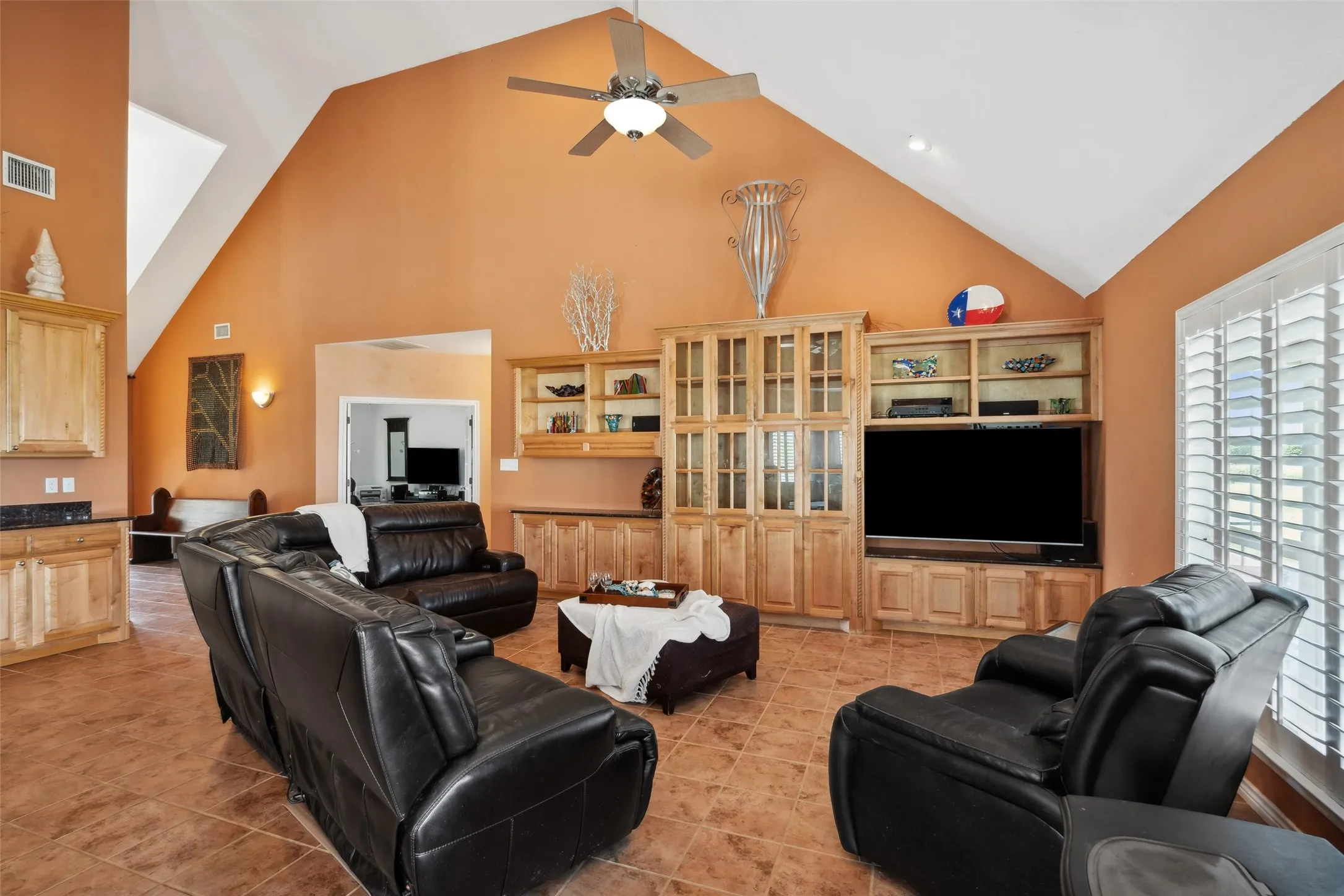 The living room has beautiful built-ins.  The left side is designed for a fish tank.