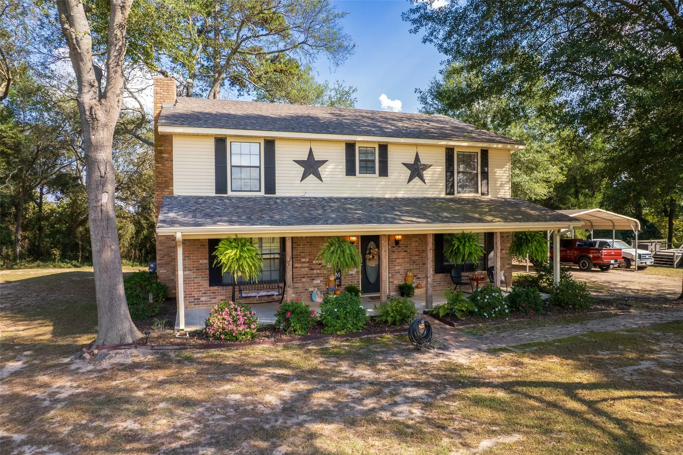 Set in trees & tucked away at end of county road for privacy
