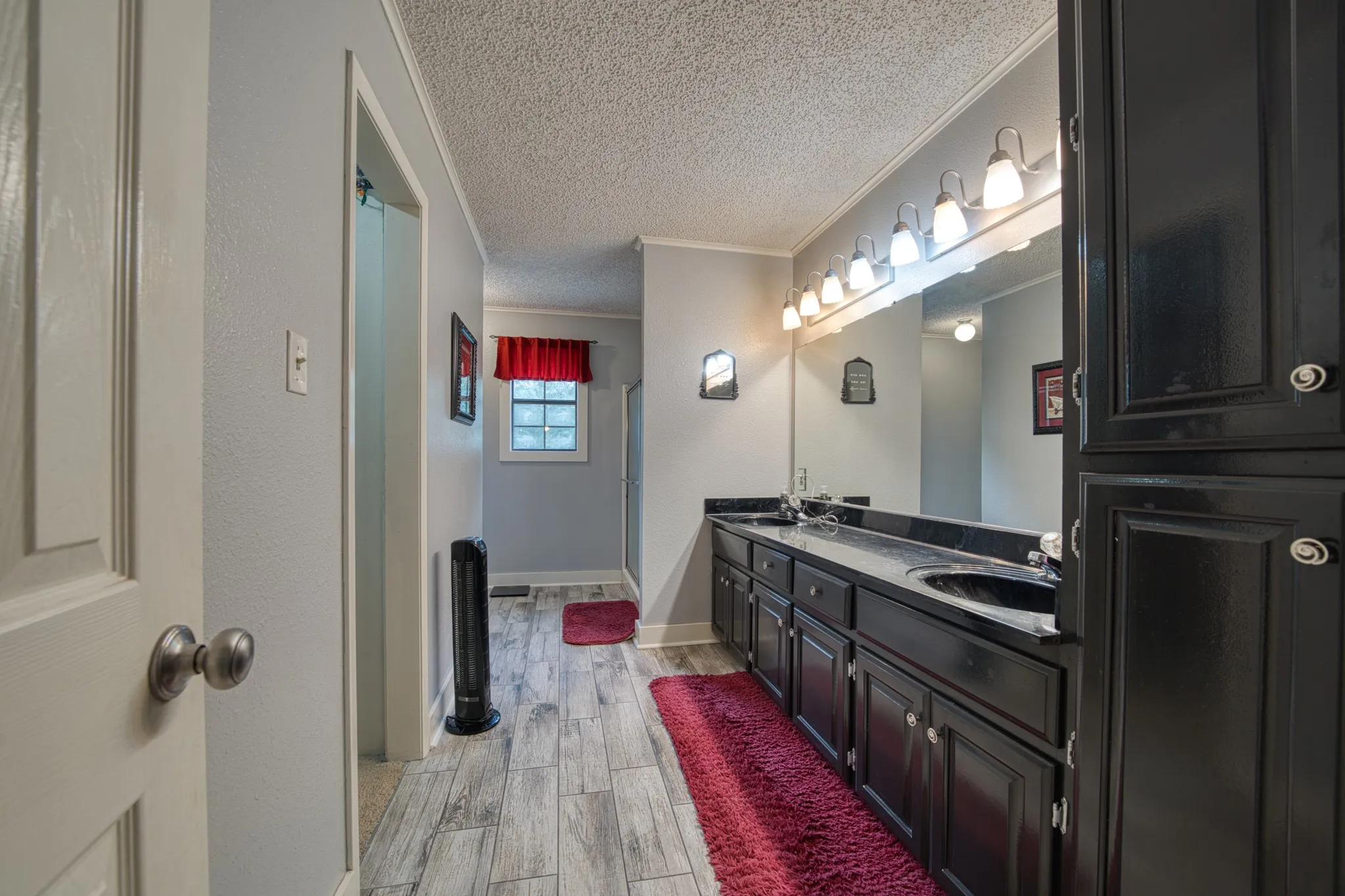 Double sinks with cabinets for storage, linens, towels