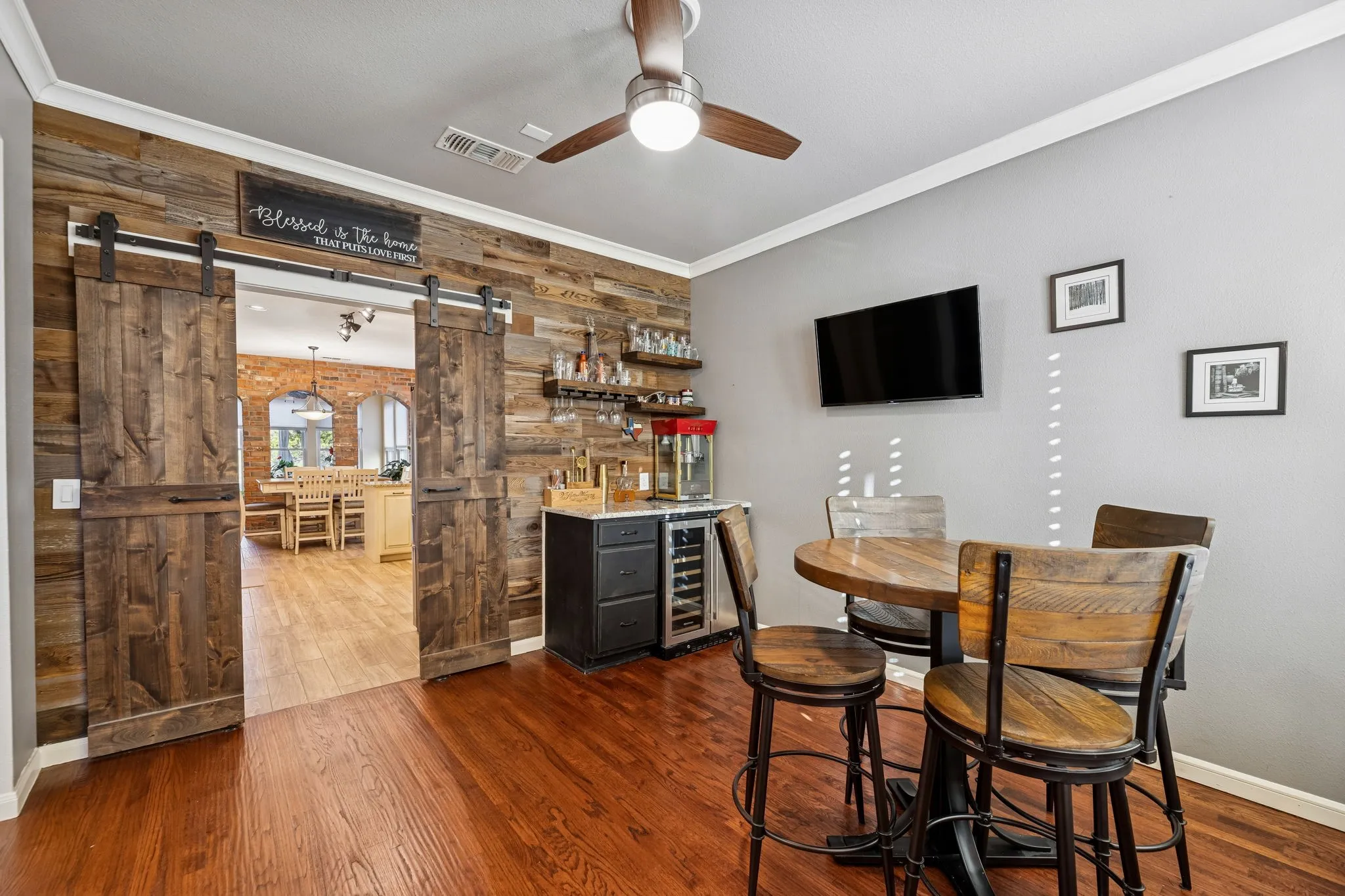 Formal dining area now being used as bar gathering area. Gorgeous barn doors