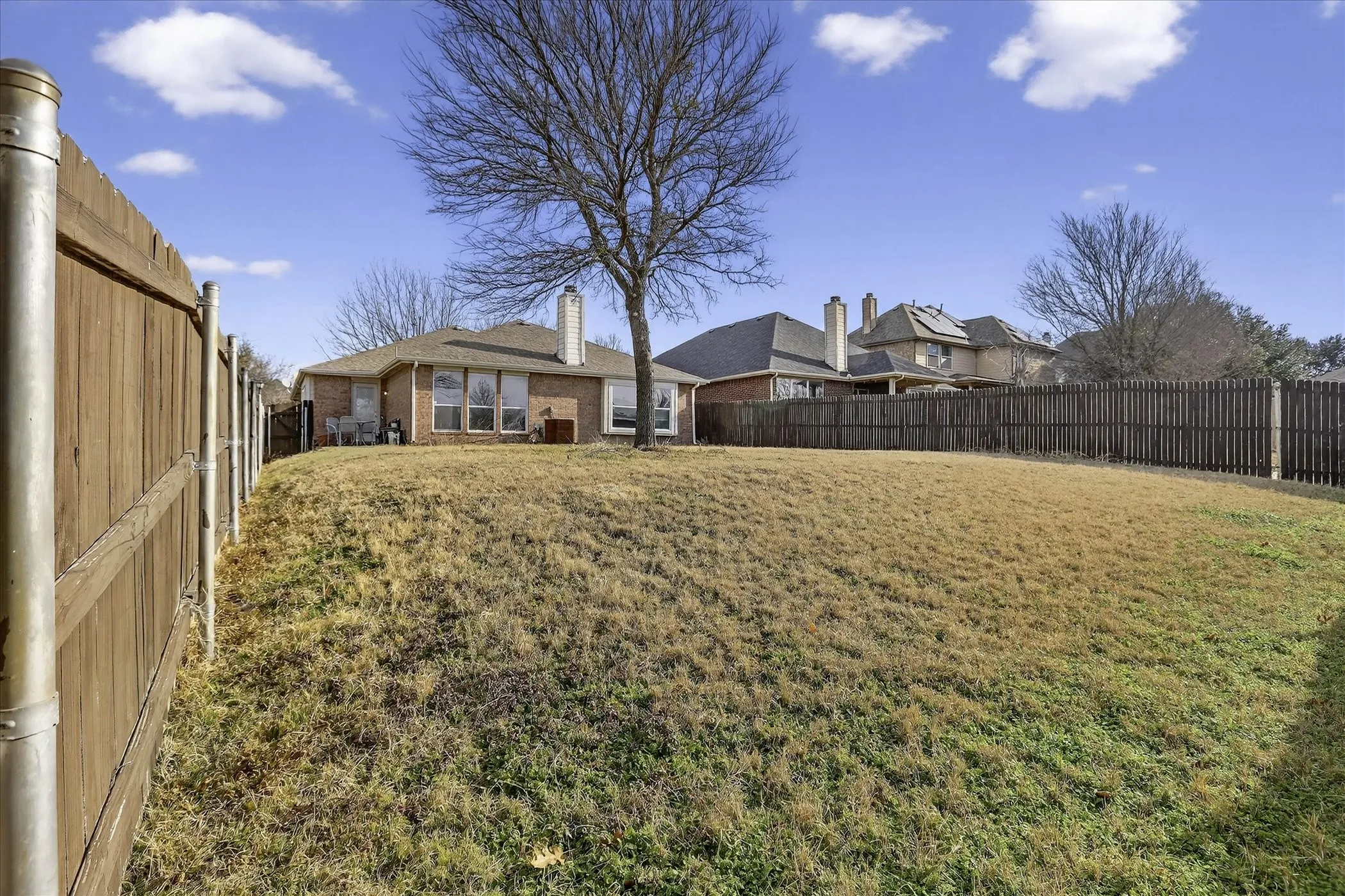 View of fenced backyard