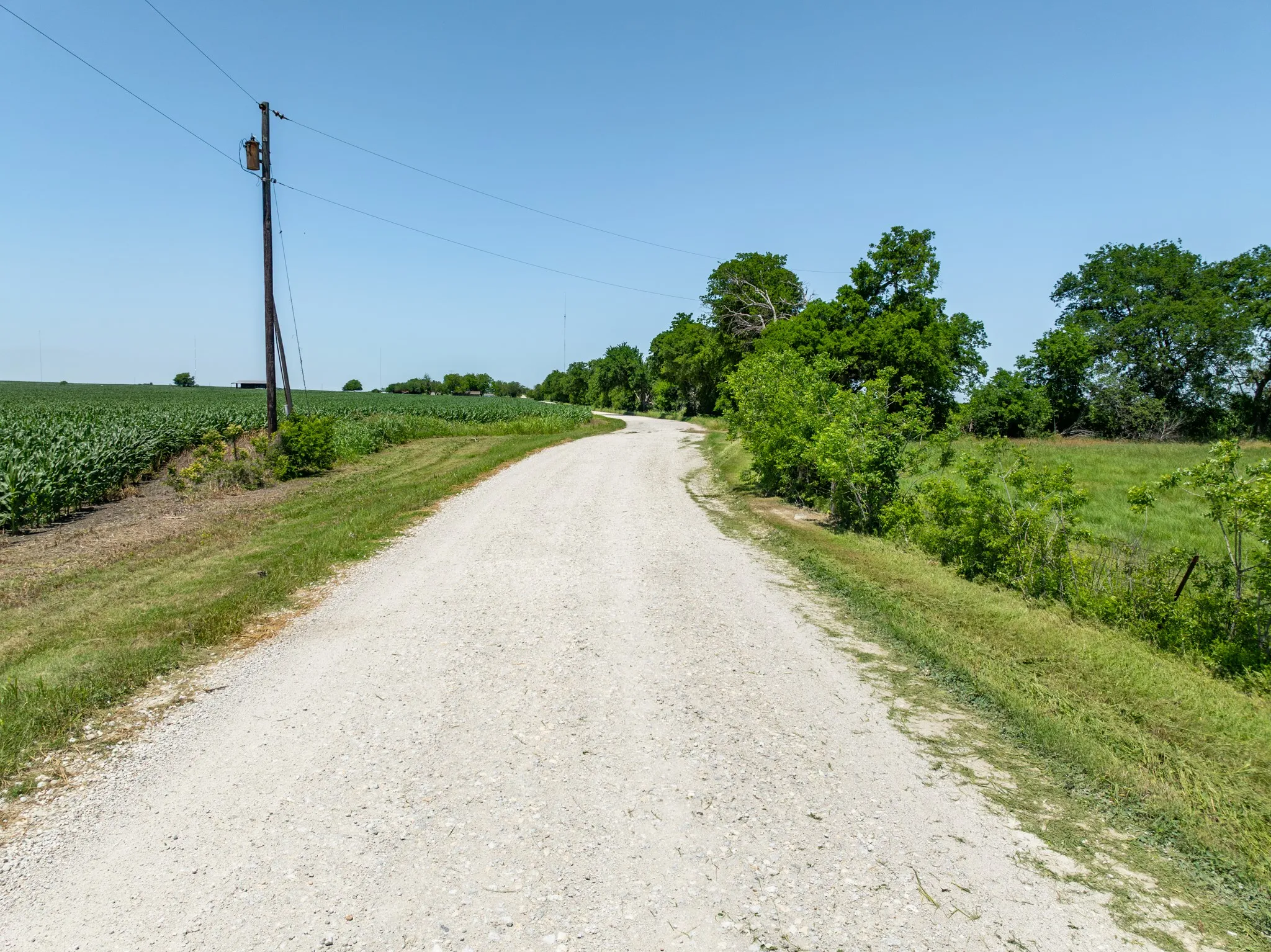 View of dirt / gravel road featuring a rural view