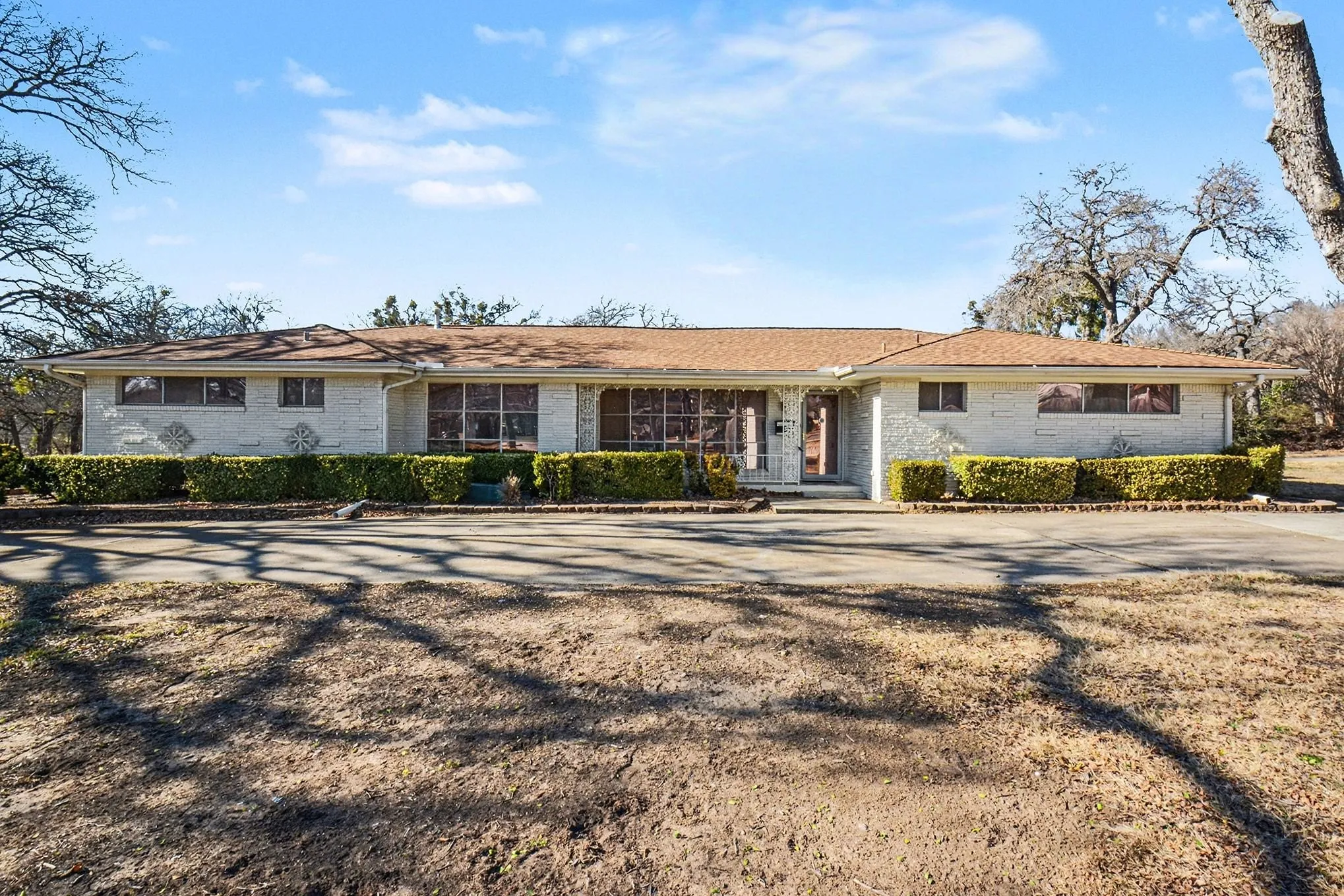 Ranch-style home featuring brick siding