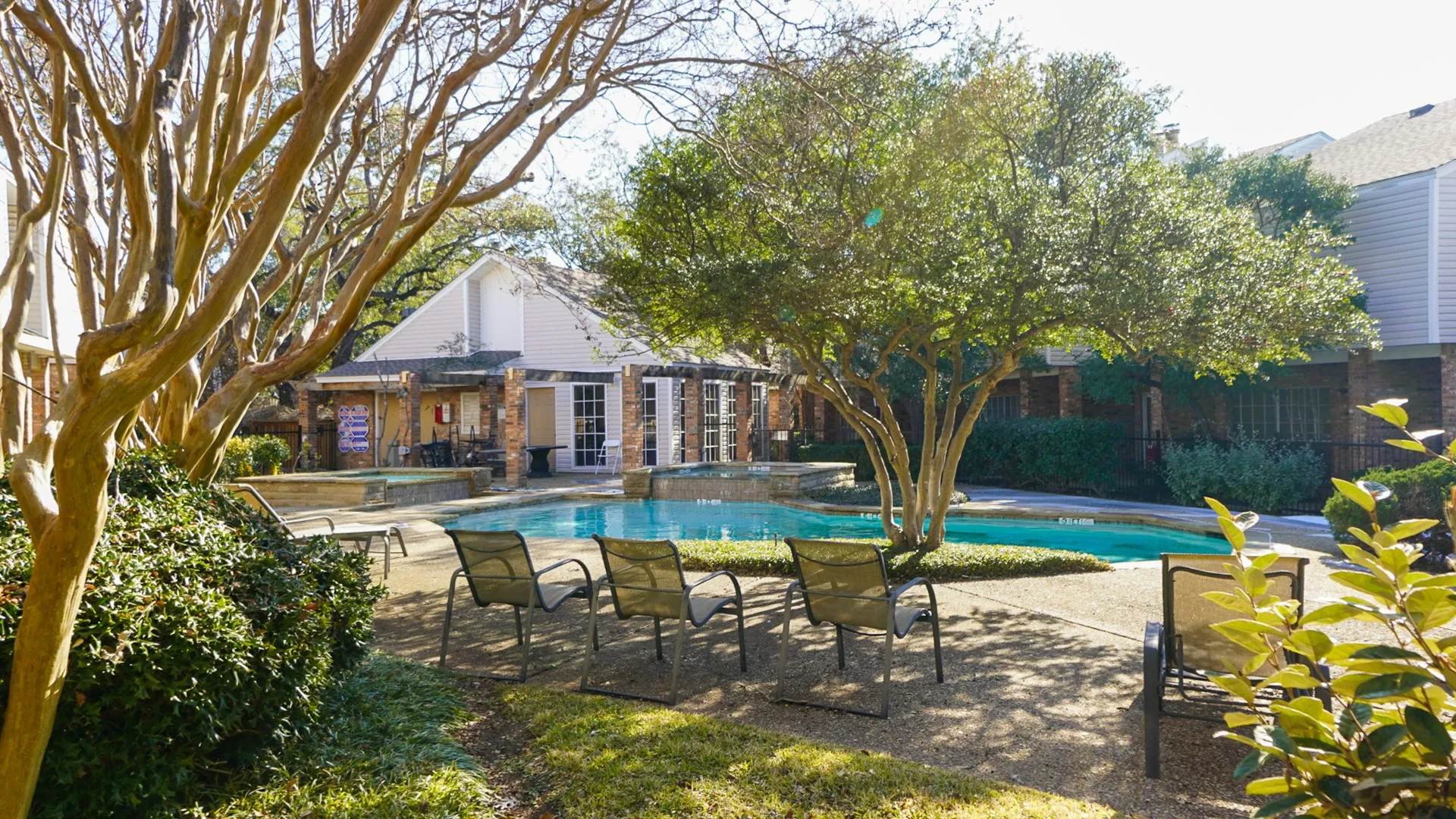 Integrated pool / hot tub featuring a patio and clubhouse