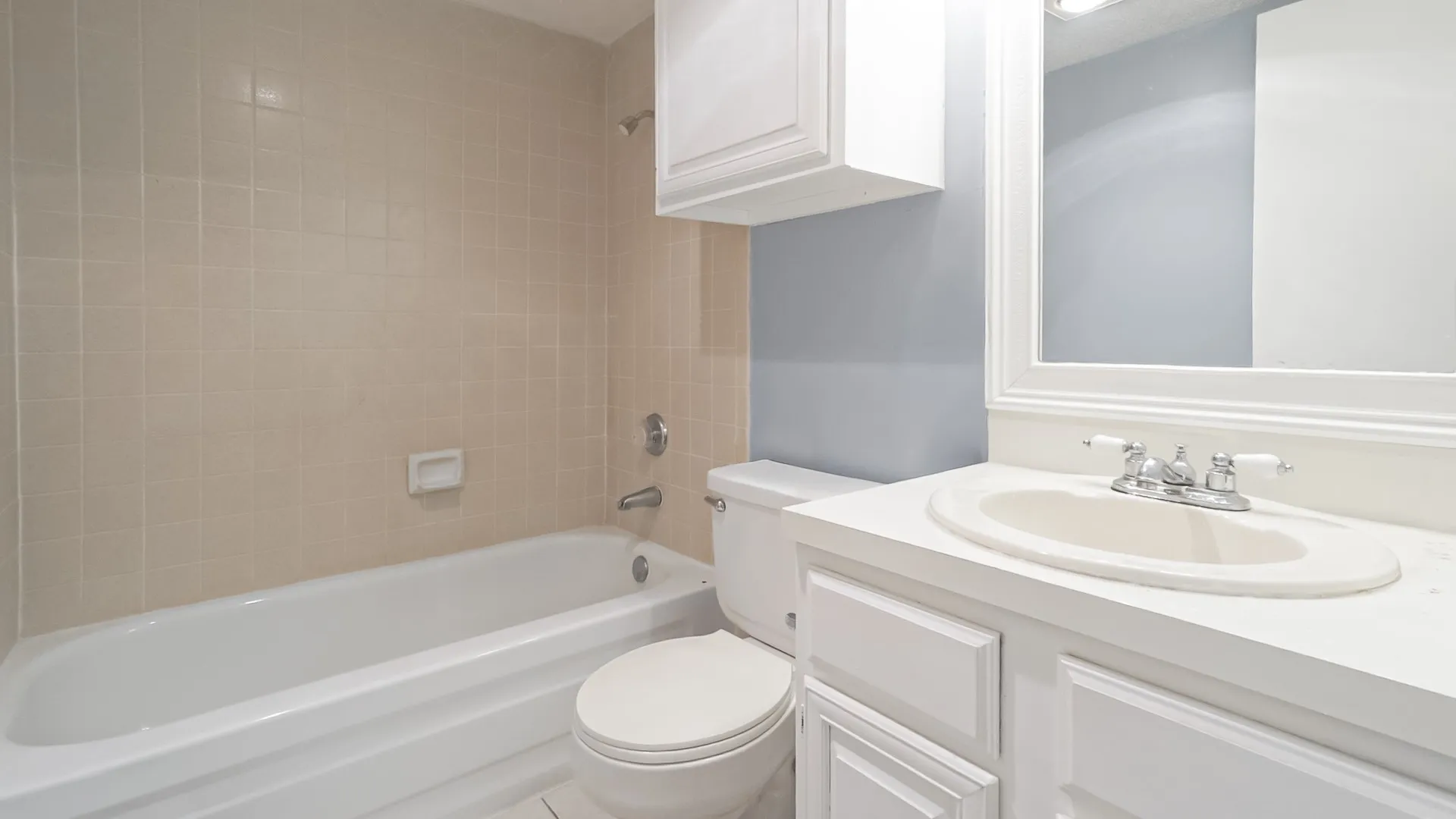 Full bath featuring shower / washtub combination and vanity