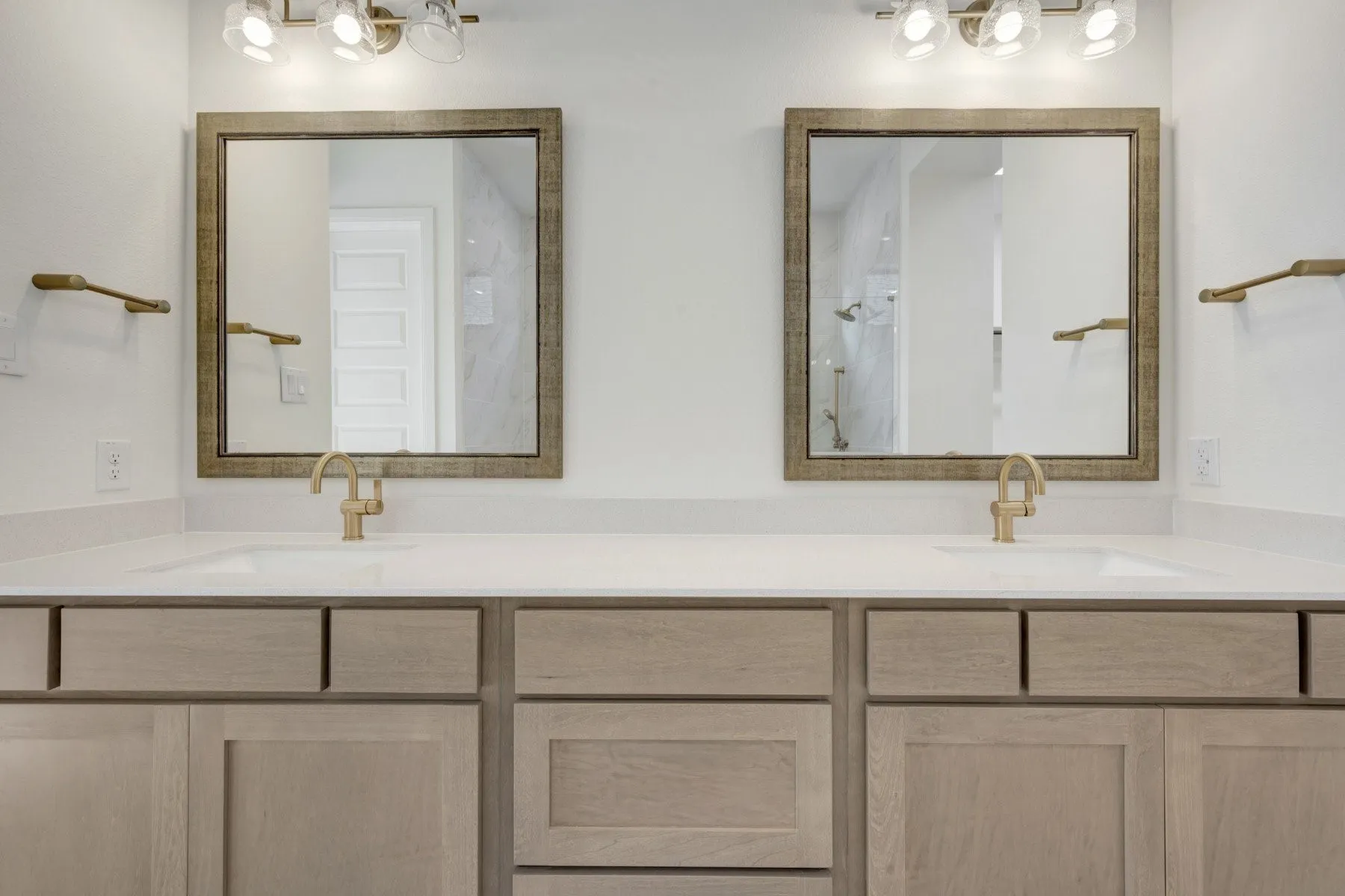 Dual integrated sinks with light-toned countertops