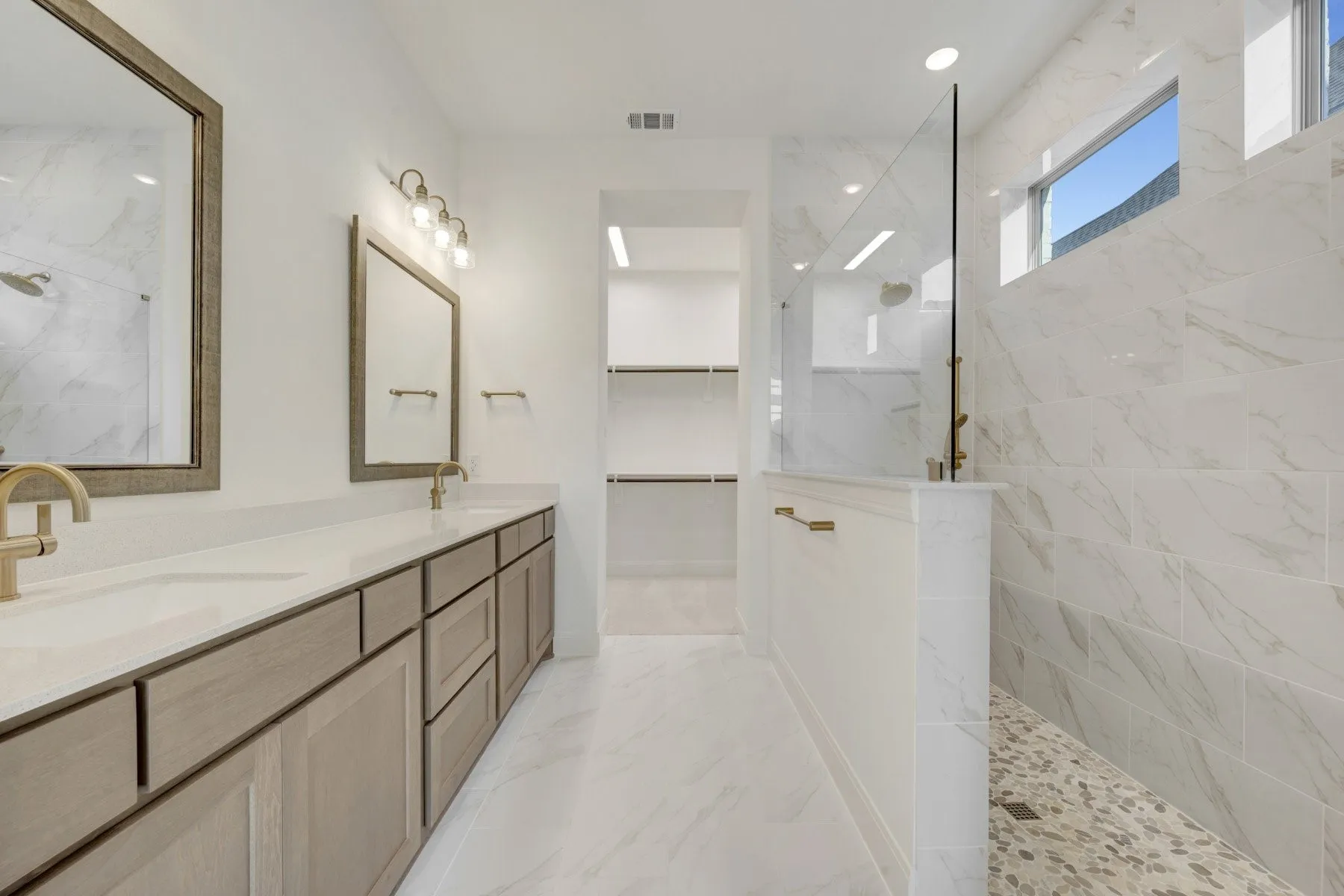 Dual vanities with integrated sinks and gold-tone fixtures