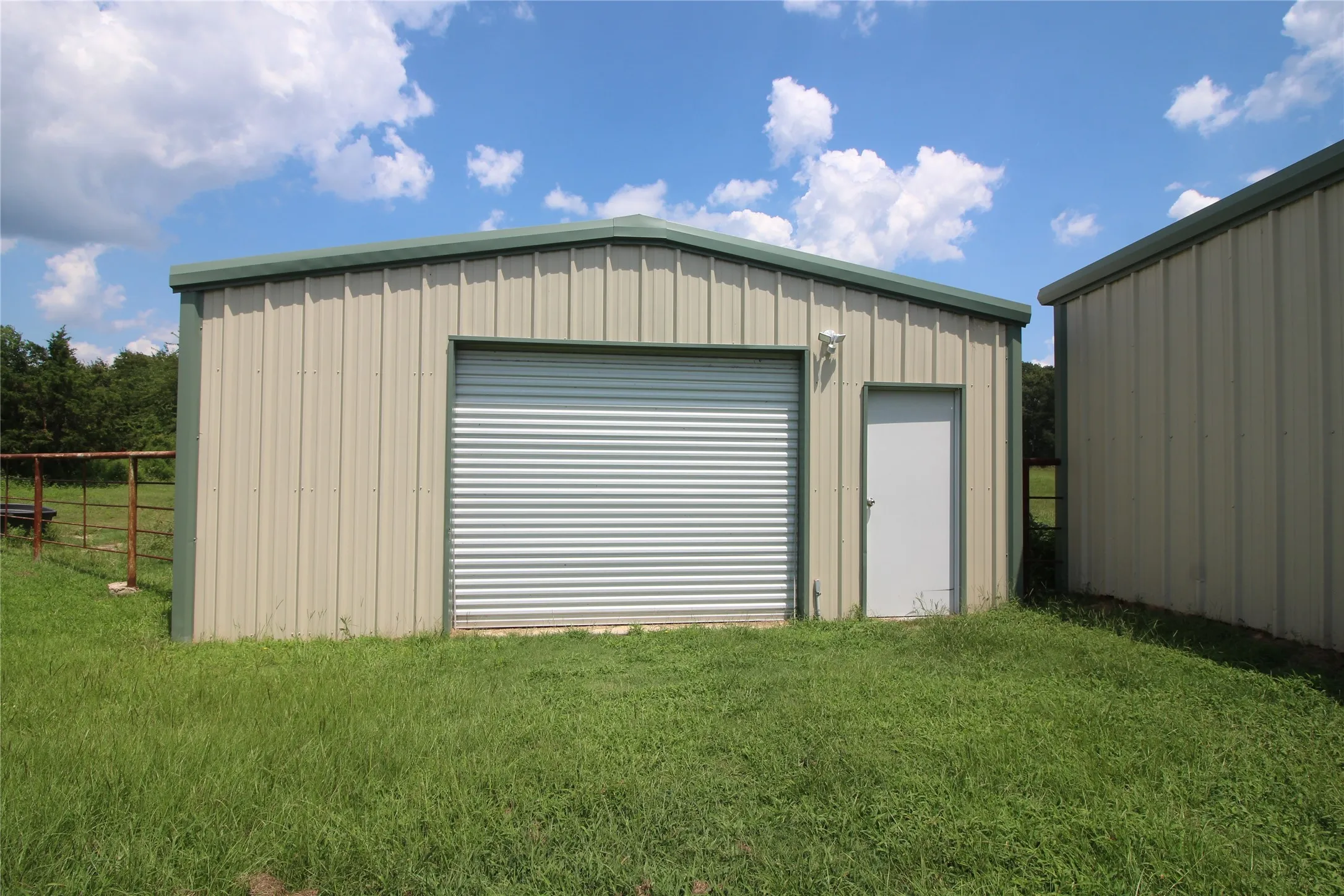 View of detached garage/workshop.  It is lightly insulated and has electricity and a cement floor, approximately 23 x 23.