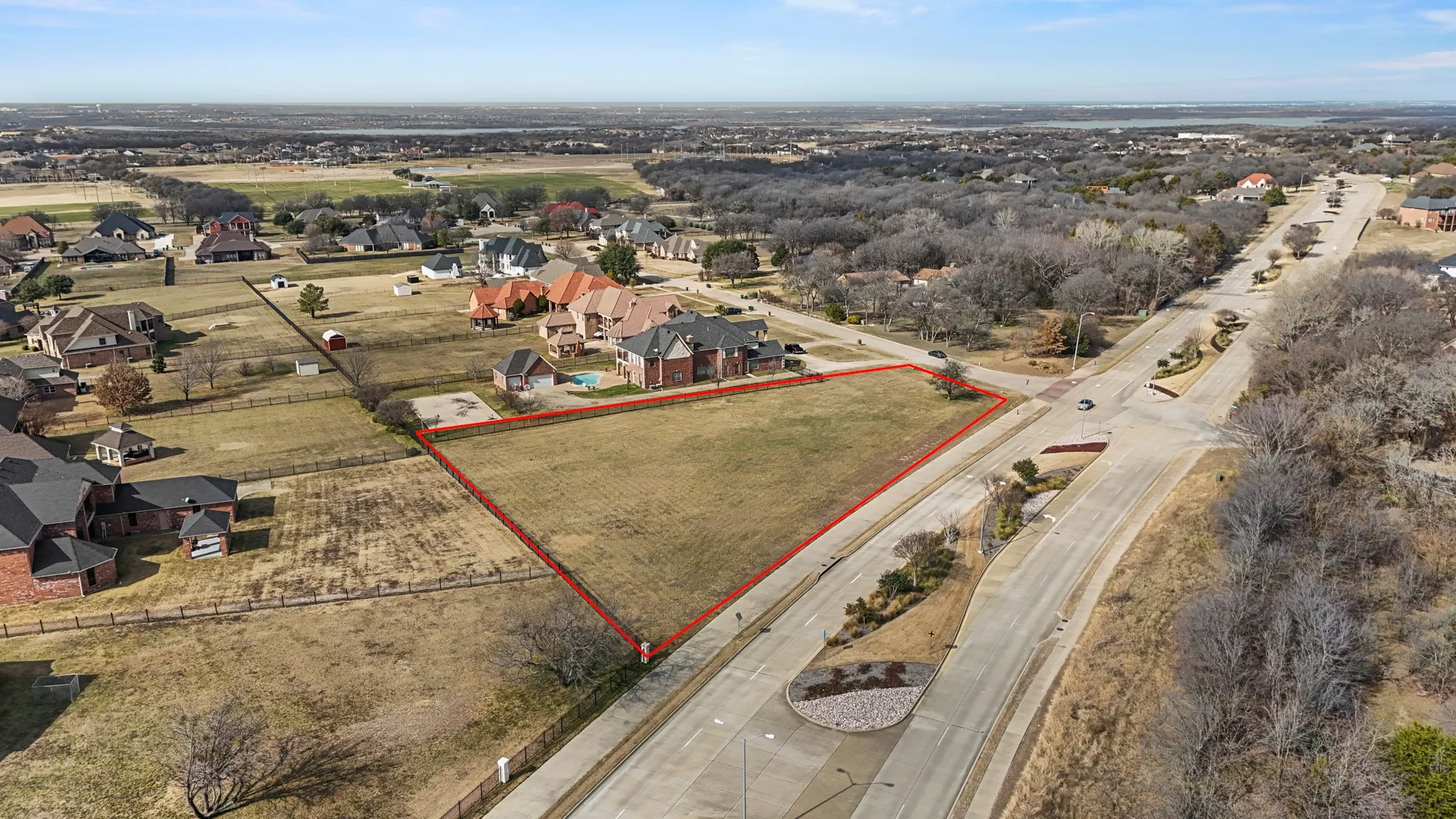 Aerial view of property and surrounding area featuring property parcel outlined