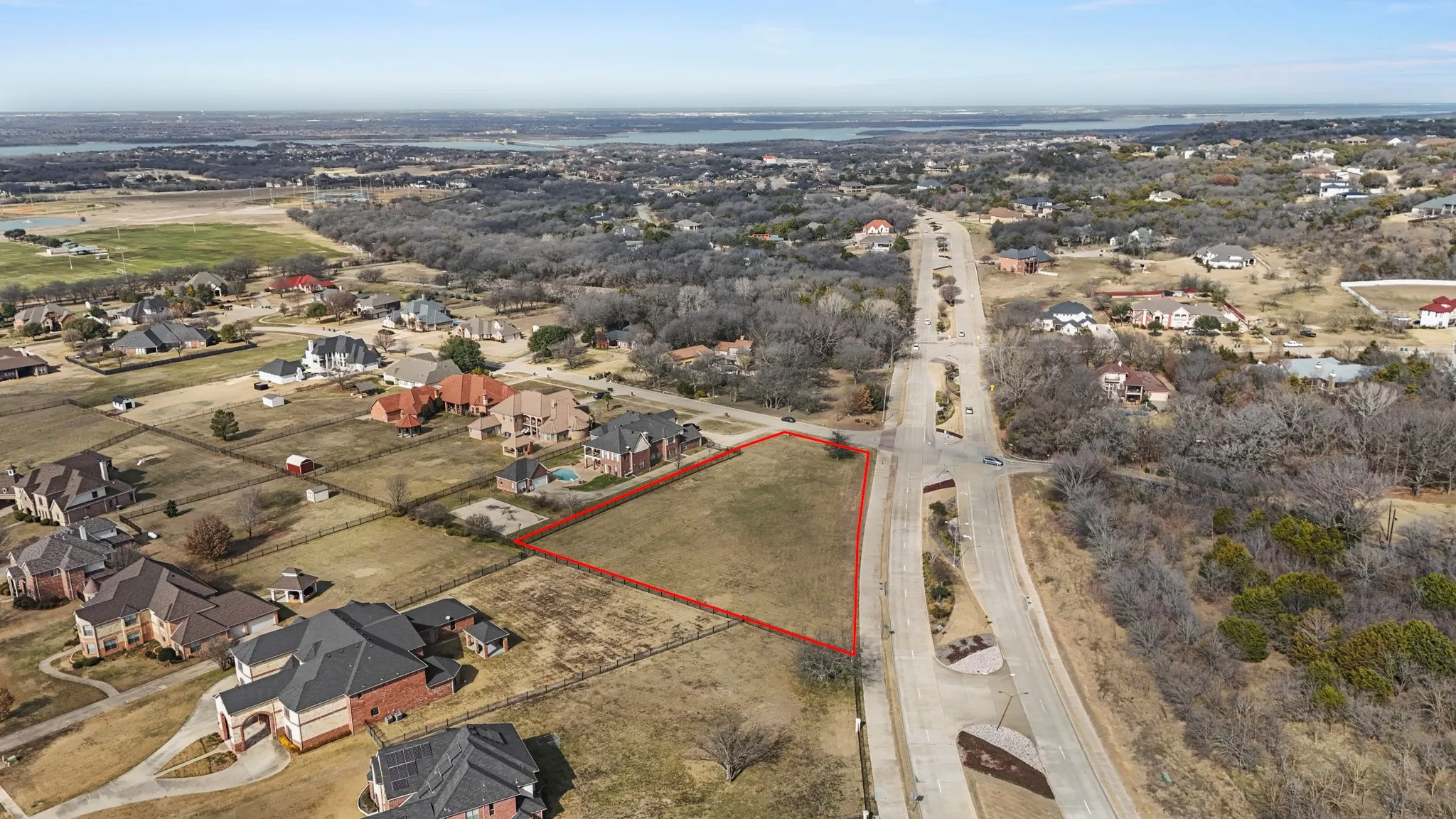 Aerial view of residential area featuring property parcel outlined