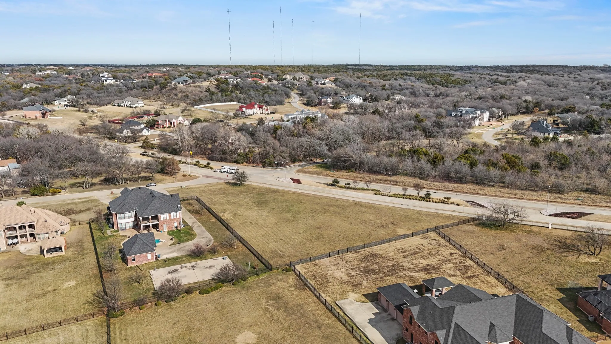 Aerial view of property's location featuring nearby suburban area