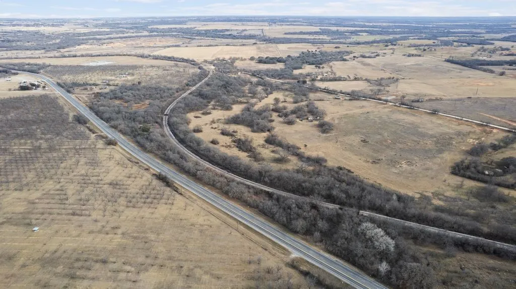 Aerial view of property's location with rural landscape
