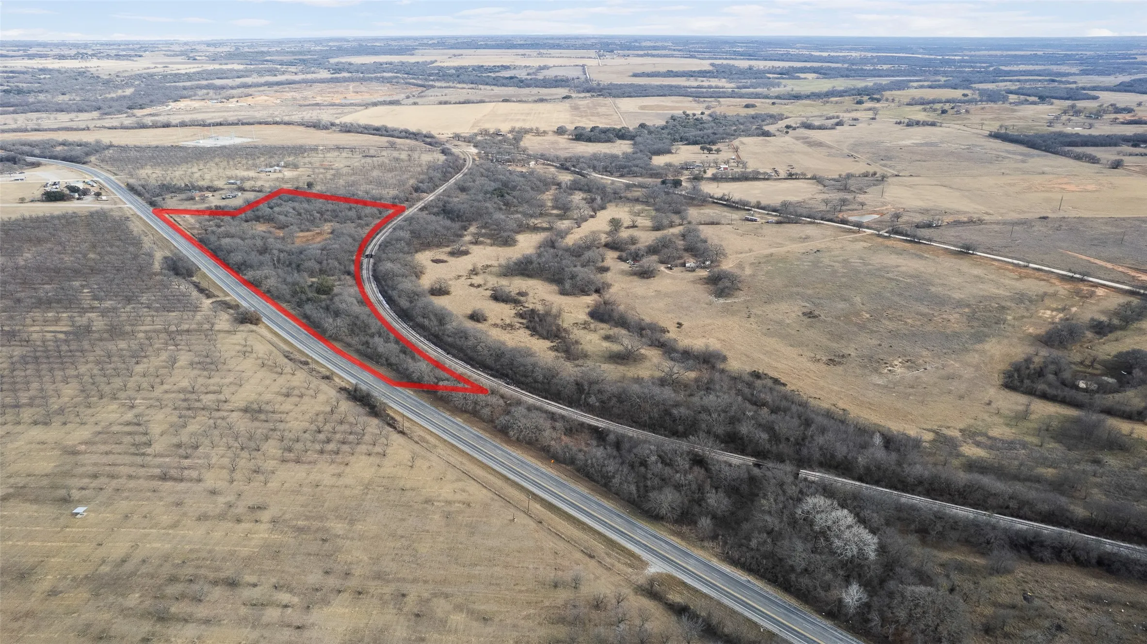 Aerial view of property and surrounding area featuring rural landscape