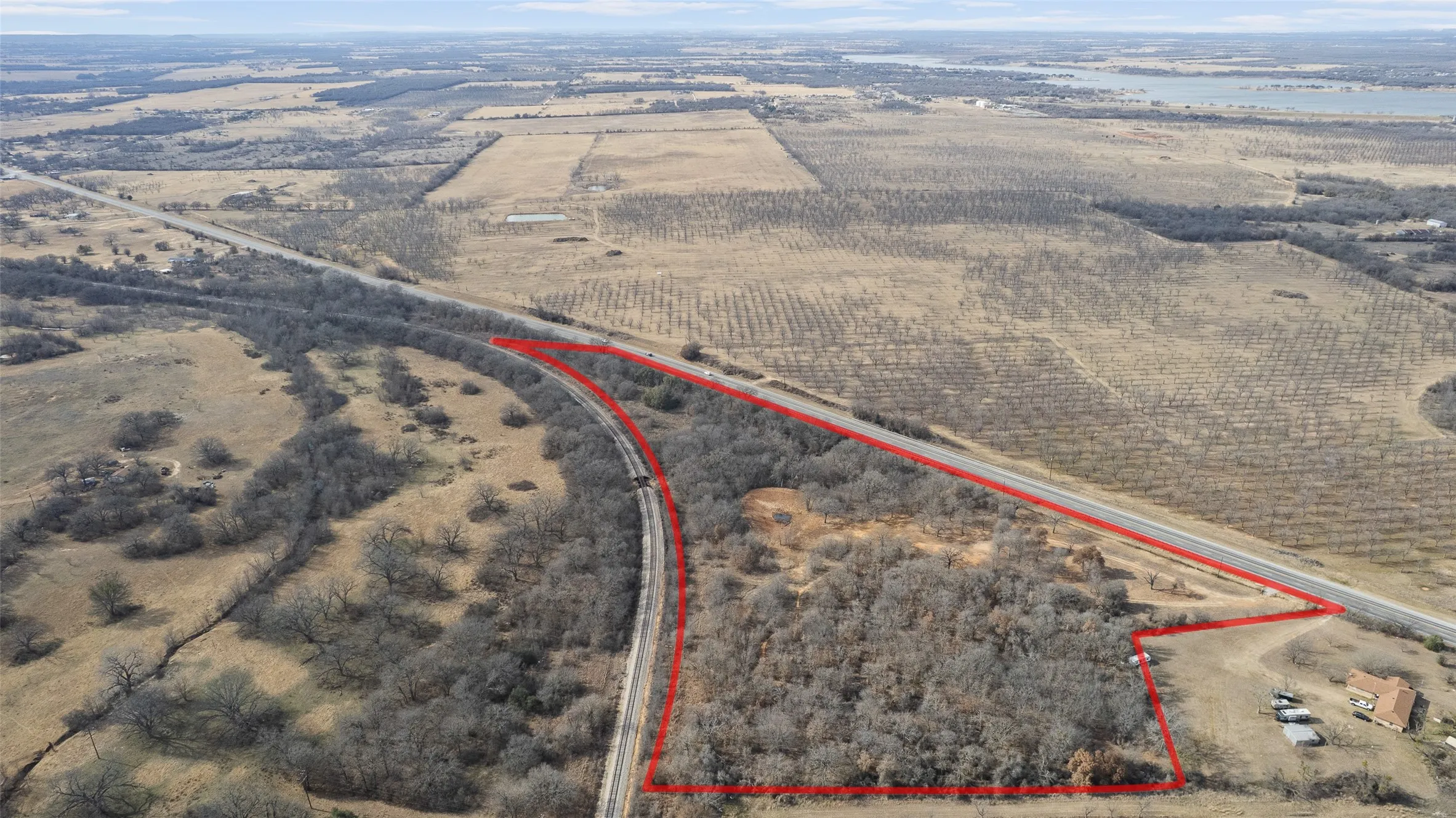 Aerial view of property's location featuring rural landscape and property parcel outlined