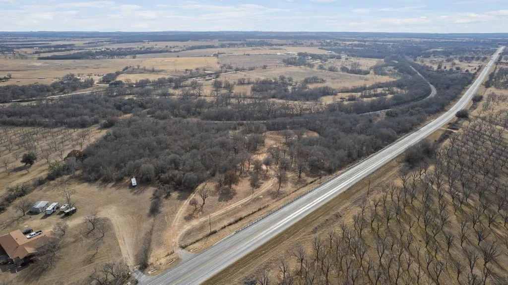 Aerial view of property's location with rural landscape
