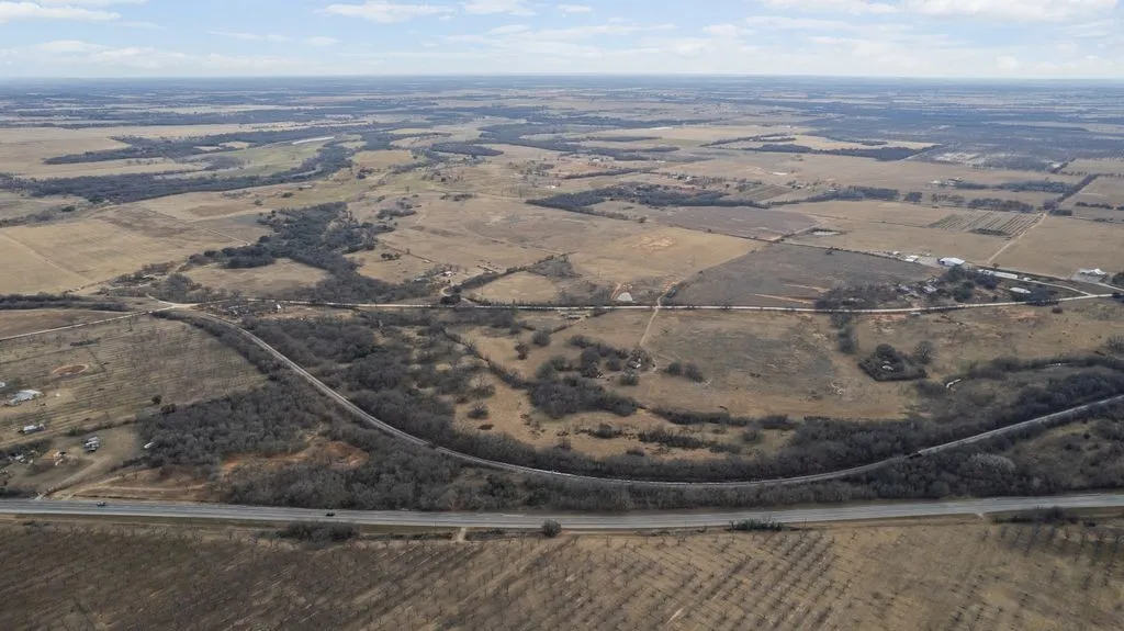 Aerial view of property and surrounding area with rural landscape