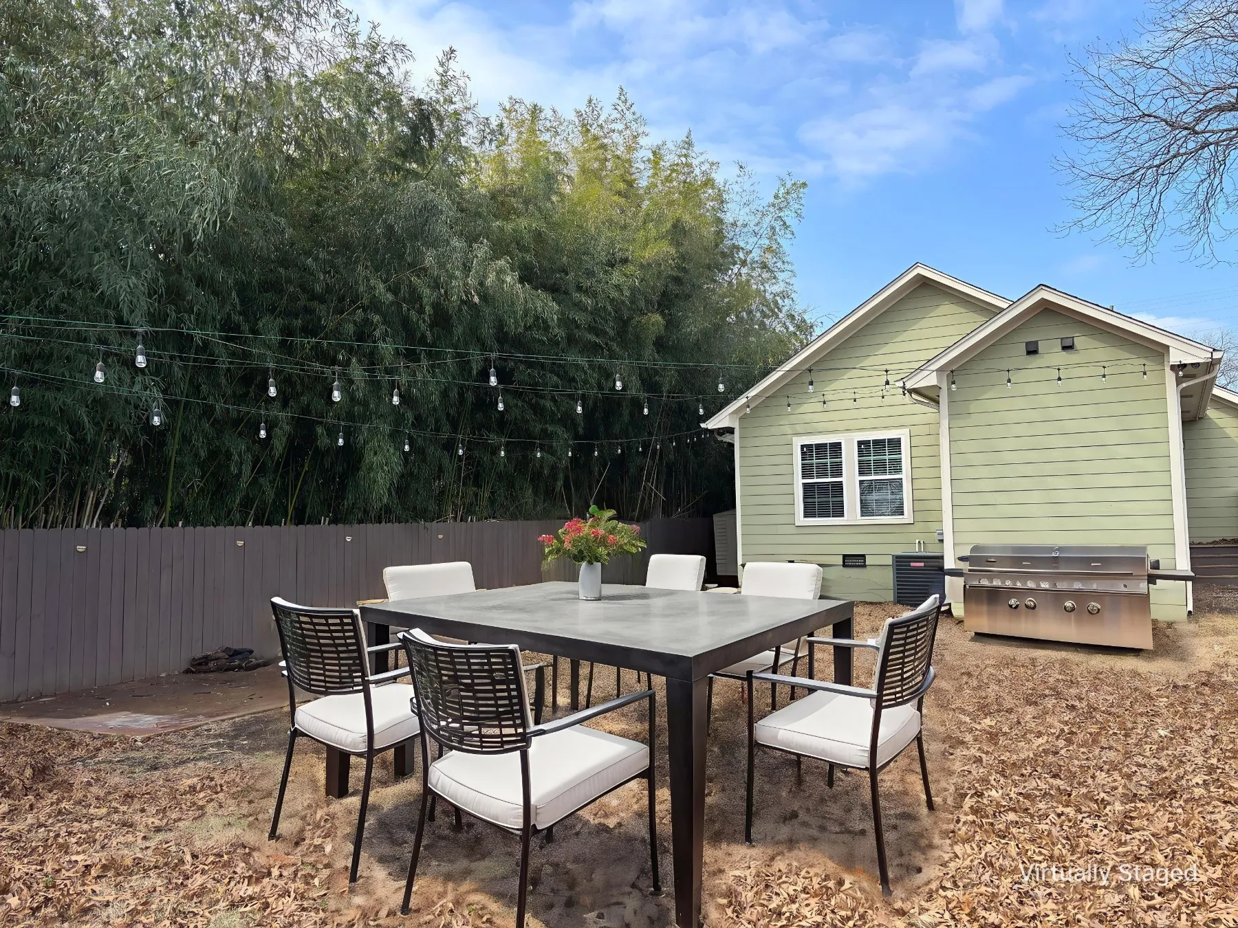 View of patio featuring outdoor dining space and grilling area