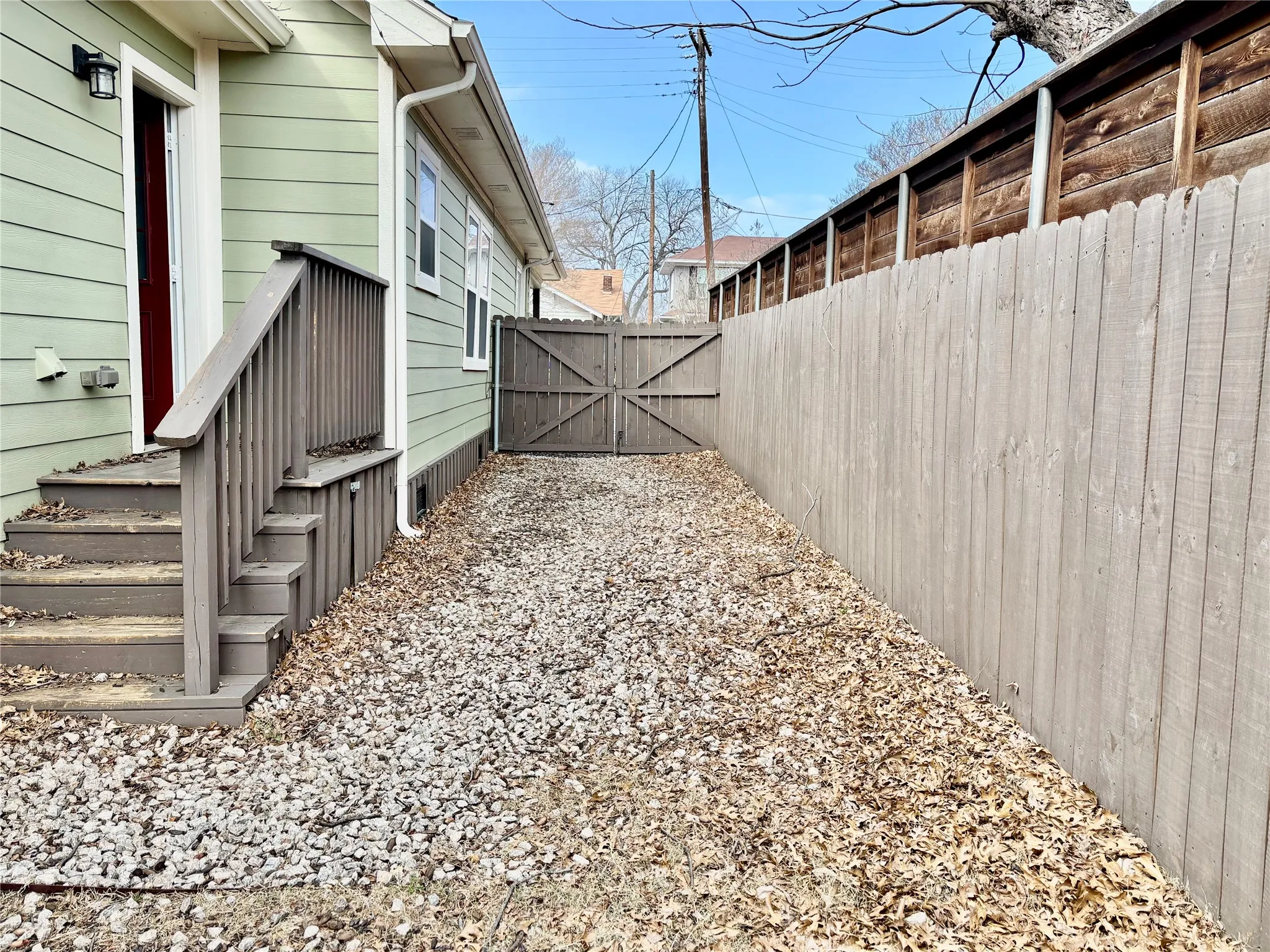 Fenced backyard with a gate