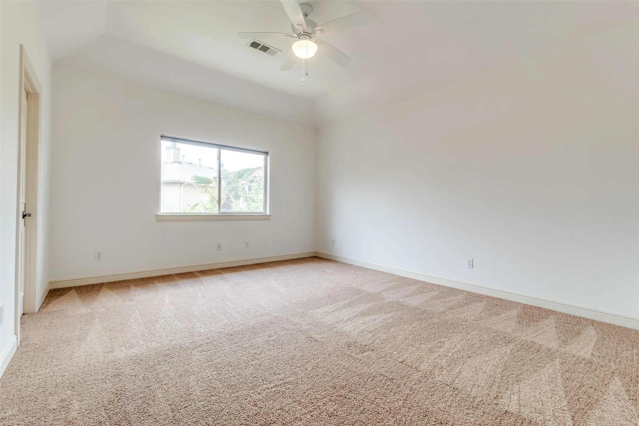2nd floor bedroom with light carpet