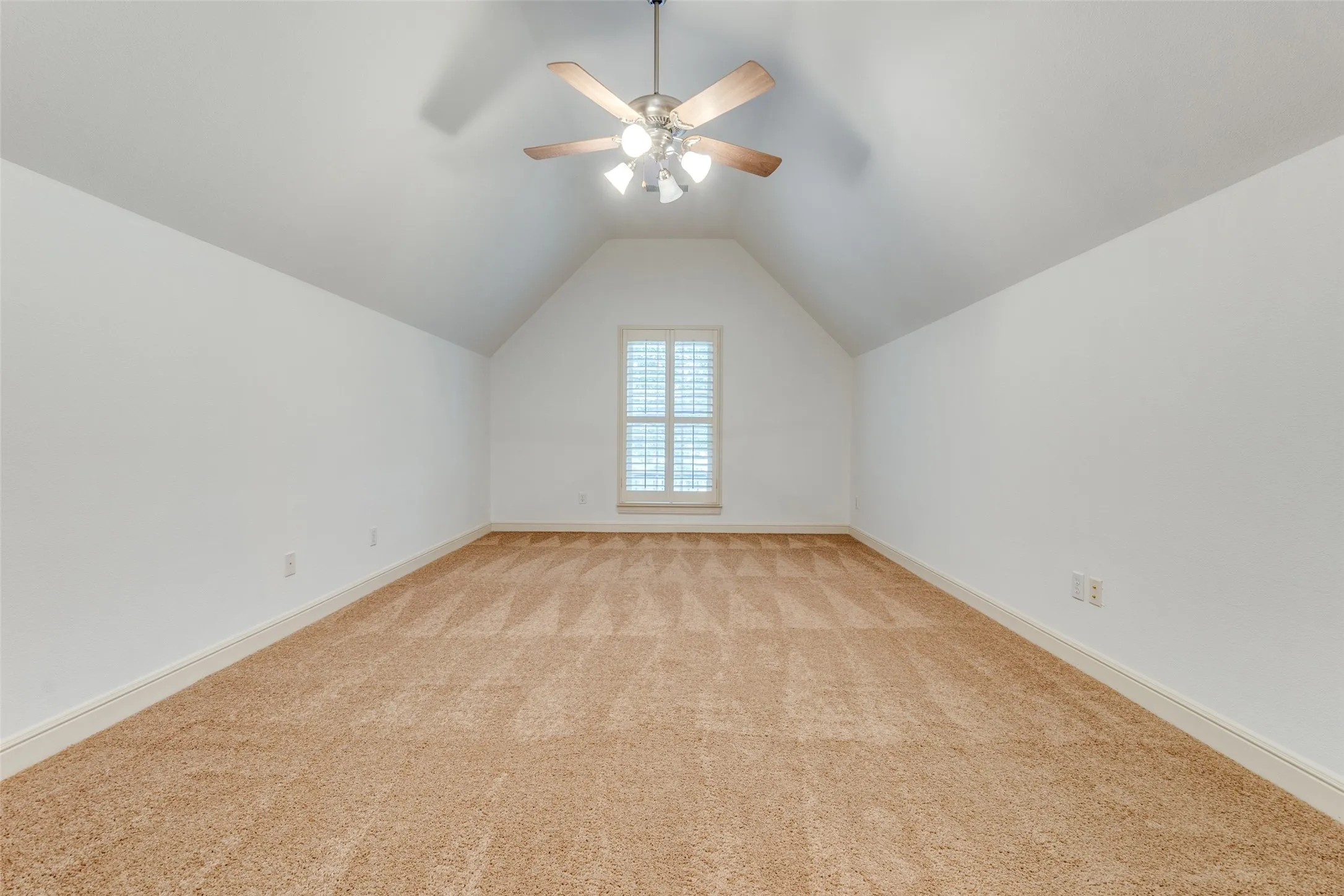 Bonus room with light colored carpet and add'l attic/storage space not pictured