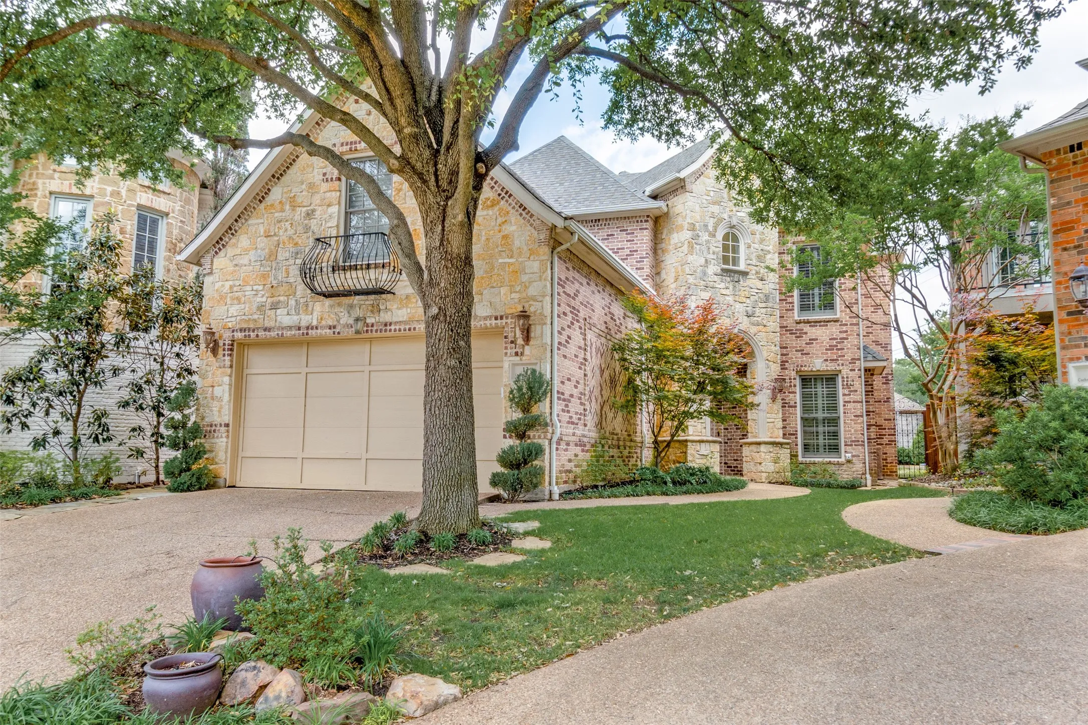 View of front of house with front lawn, stone siding