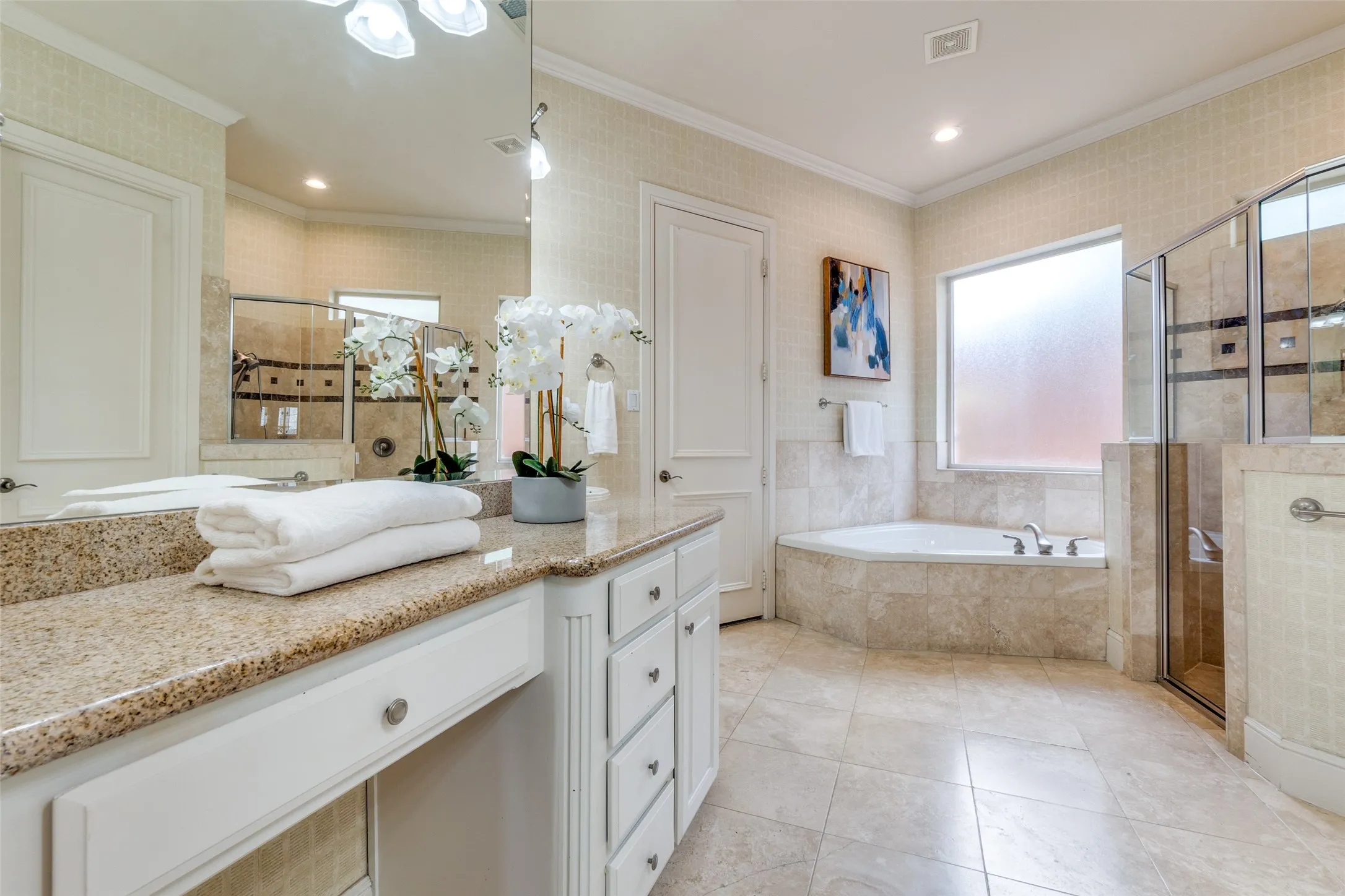 Full bathroom with a garden tub, ornamental molding, vanity, tile patterned floors, and a stall shower