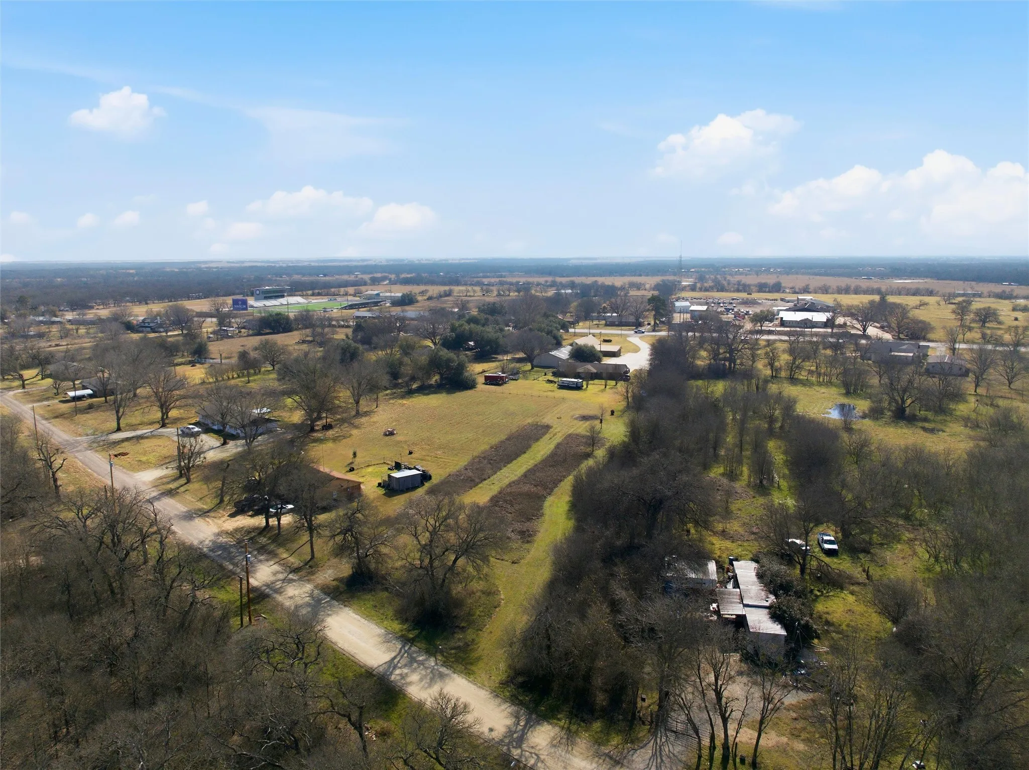 Aerial view of property's location with rural landscape
