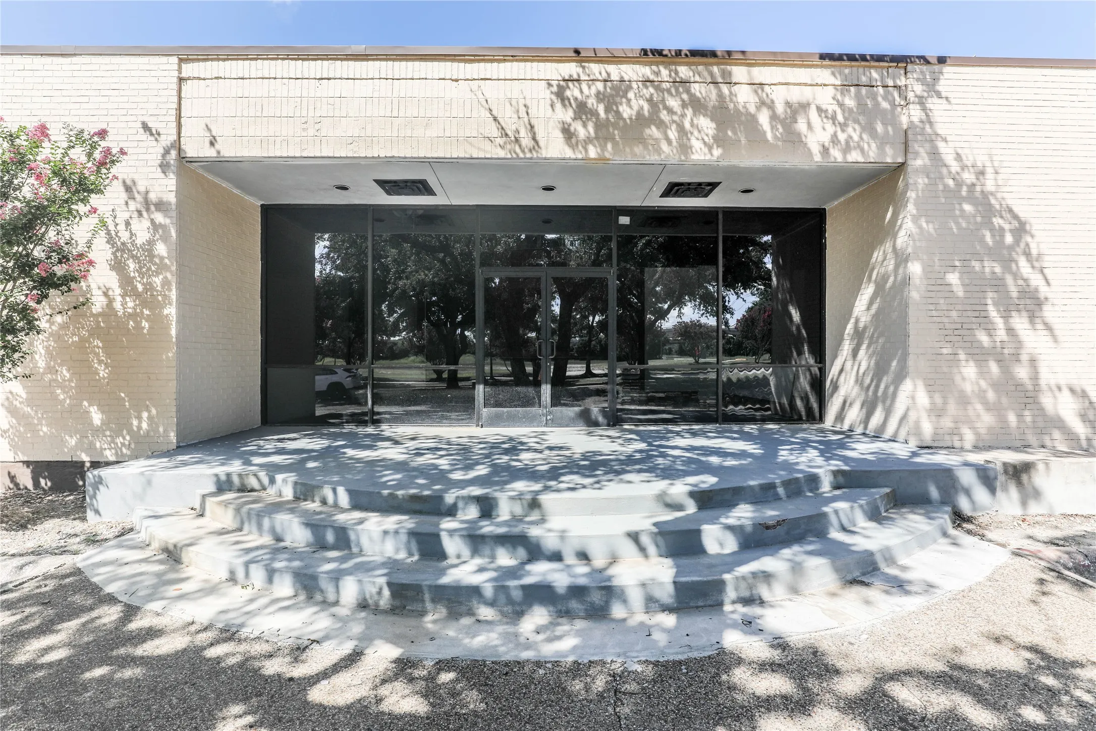 Doorway to property with brick siding