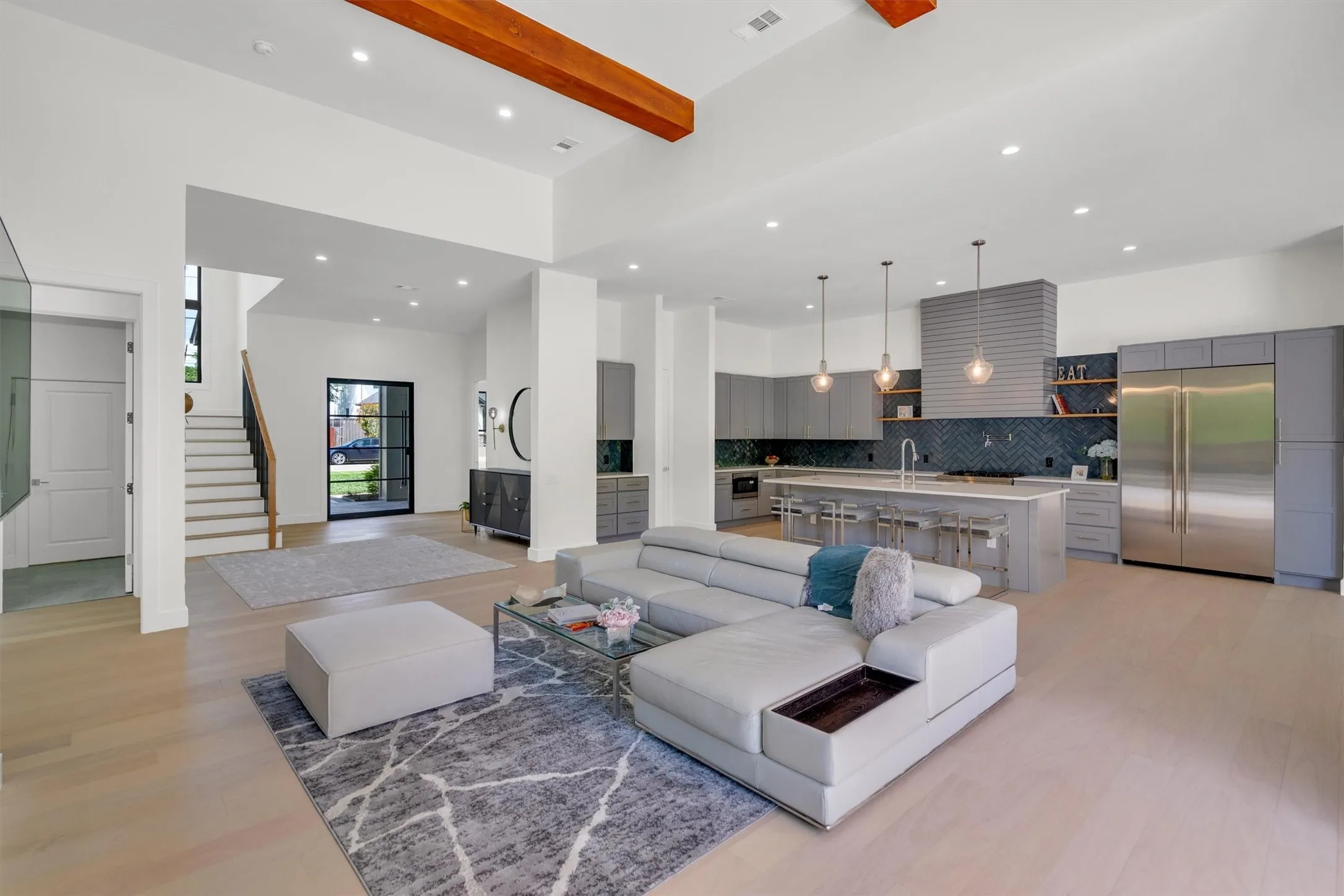 Living room featuring light wood-style floors and recessed lighting