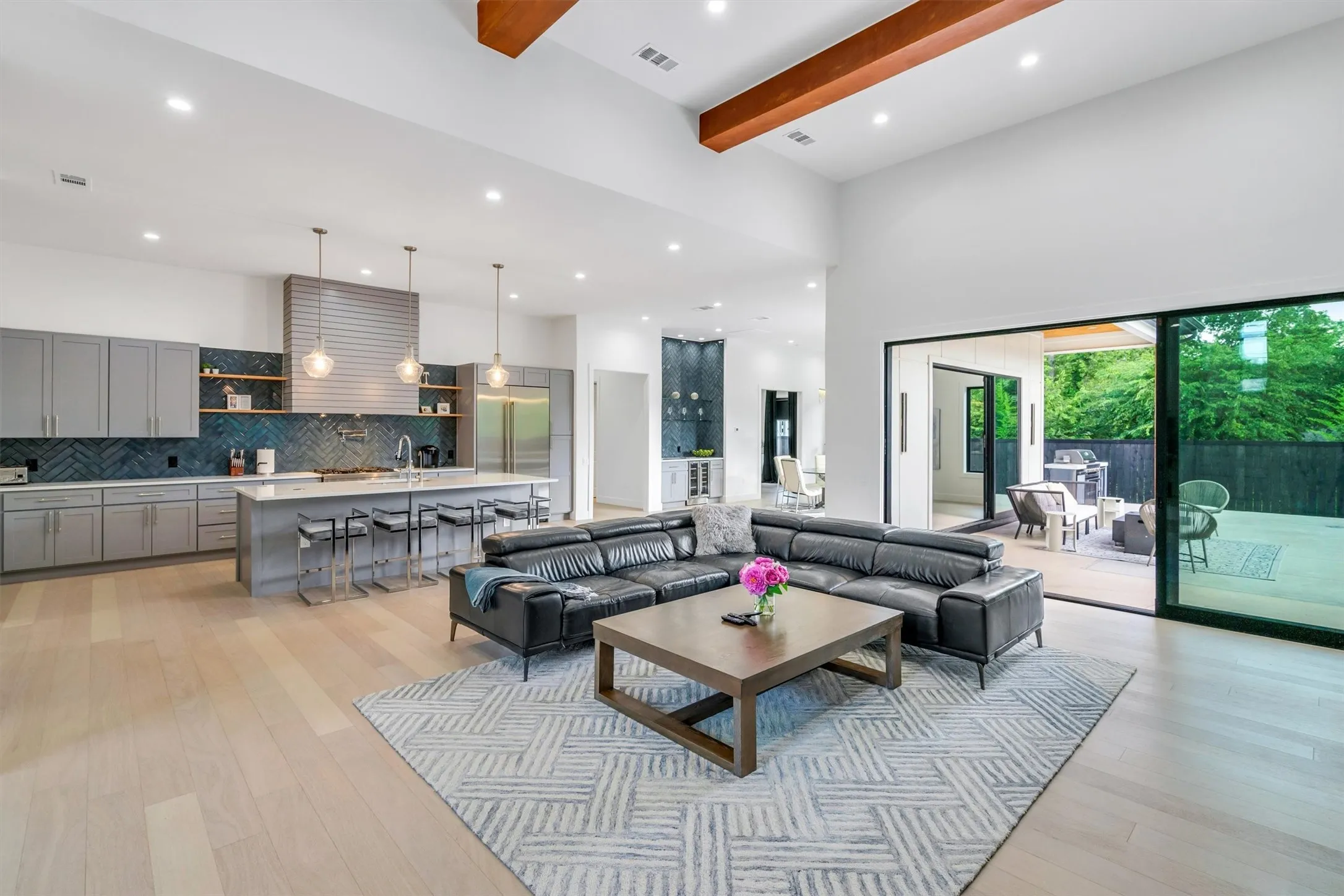 Living room featuring light wood-style flooring and recessed lighting